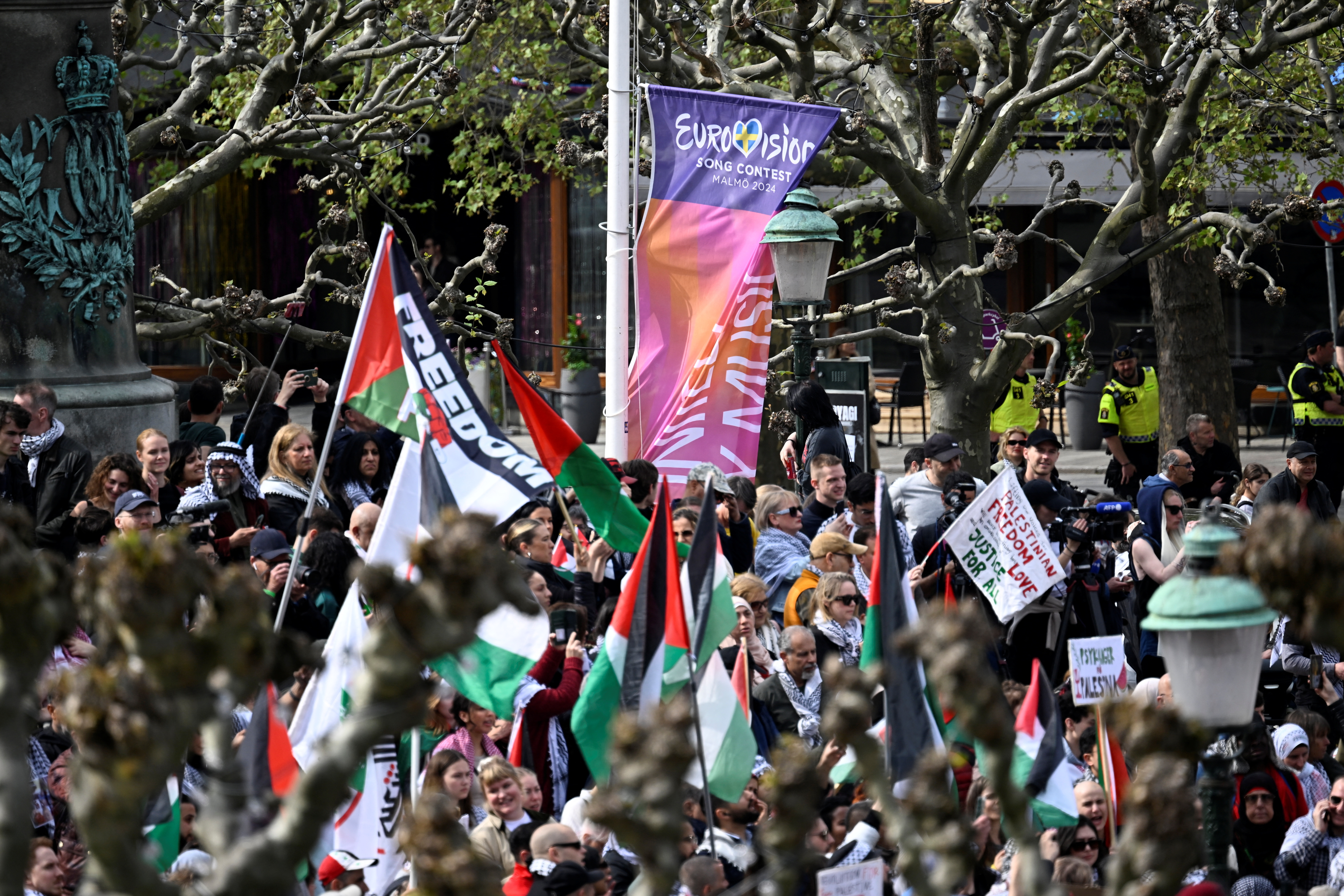 Protesters pull down a Eurovision flag during the Stop Israel demonstration against Israel's participation in the 68th edition of the Eurovision Song Contest (ESC), amid the ongoing conflict in Gaza between Israel and the Palestinian Islamist group Hamas, in Malmo, Sweden, May 9, 2024