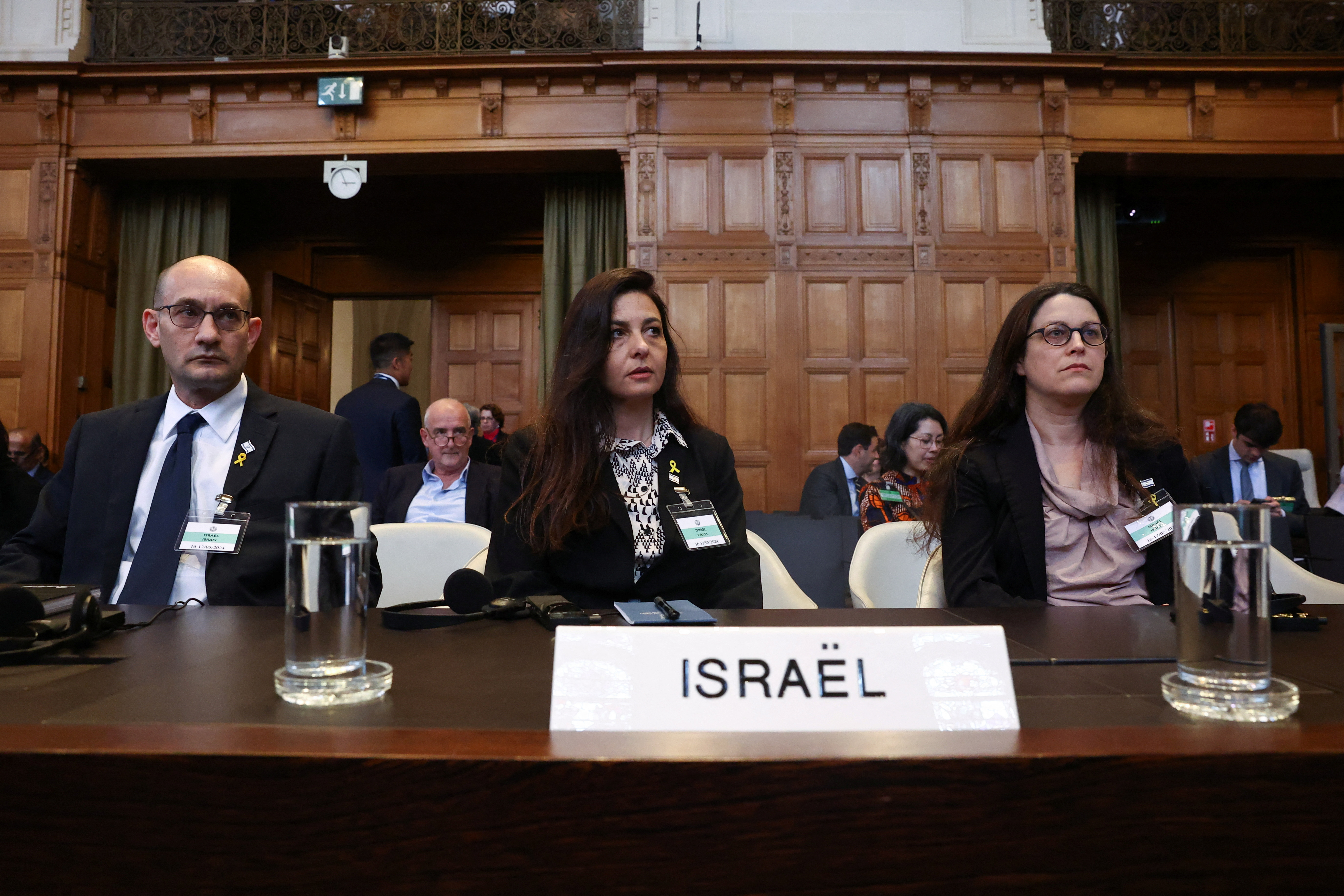 Deputy Attorney General for International Law Gilad Noam, Principal Deputy Legal Adviser of the Ministry of Foreign Affairs of Israel Tamar Kaplan Tourgeman and legal adviser of the Embassy of Israel in the Netherlands Avigail Frisch Ben Avraham look on at the International Court of Justice (ICJ), at the start of a hearing where South Africa requests new emergency measures over Israel's attacks on Rafah, as part of an ongoing case South Africa filed at the ICJ in December last year accusing Israel of violating the Genocide Convention during its offensive against Palestinians in Gaza, in The Hague Netherlands May 16, 2024. REUTERS/Yves Herman