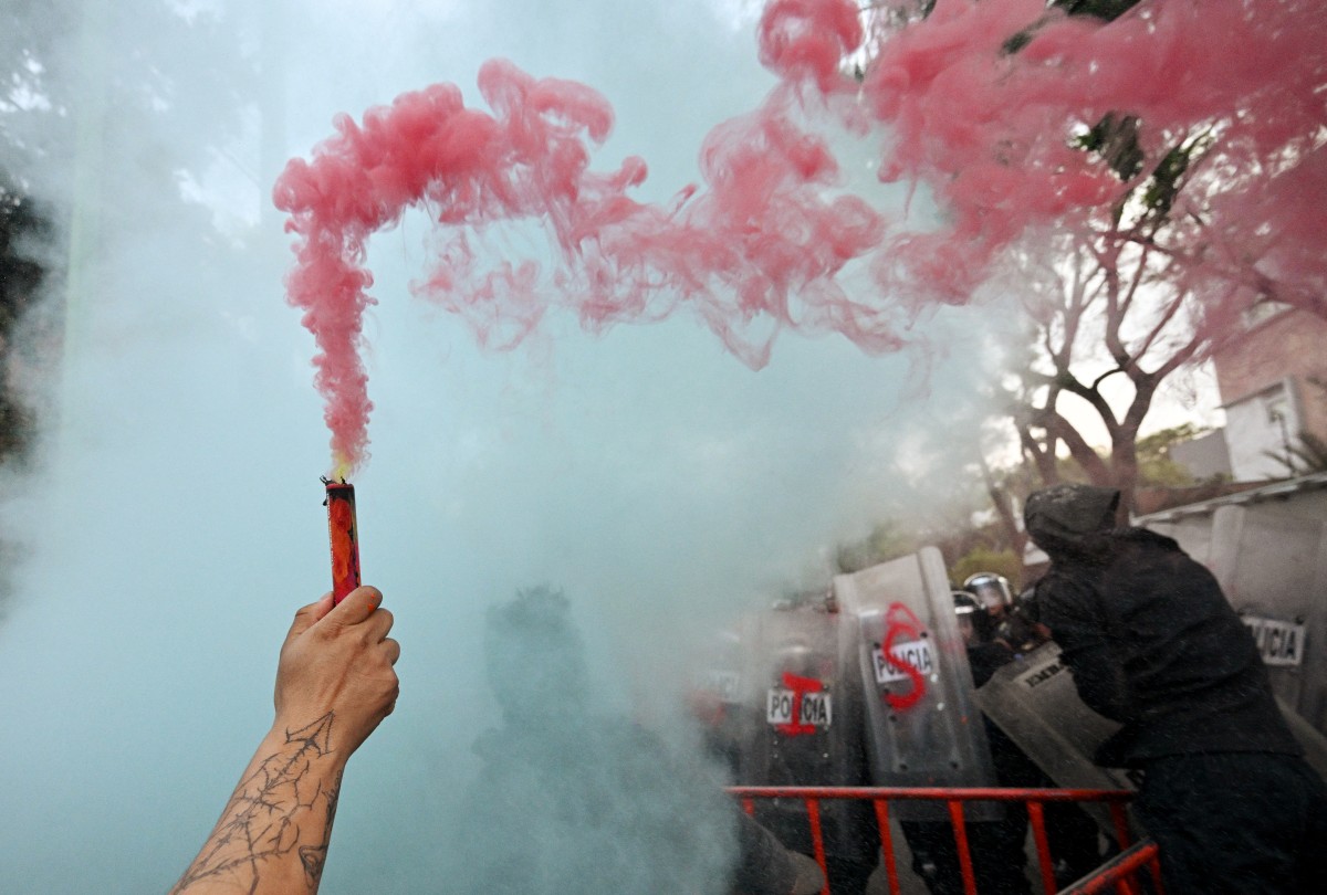 Demonstrators clash with the police during a pro-Palestinian rally called "Urgent action for Rafah"