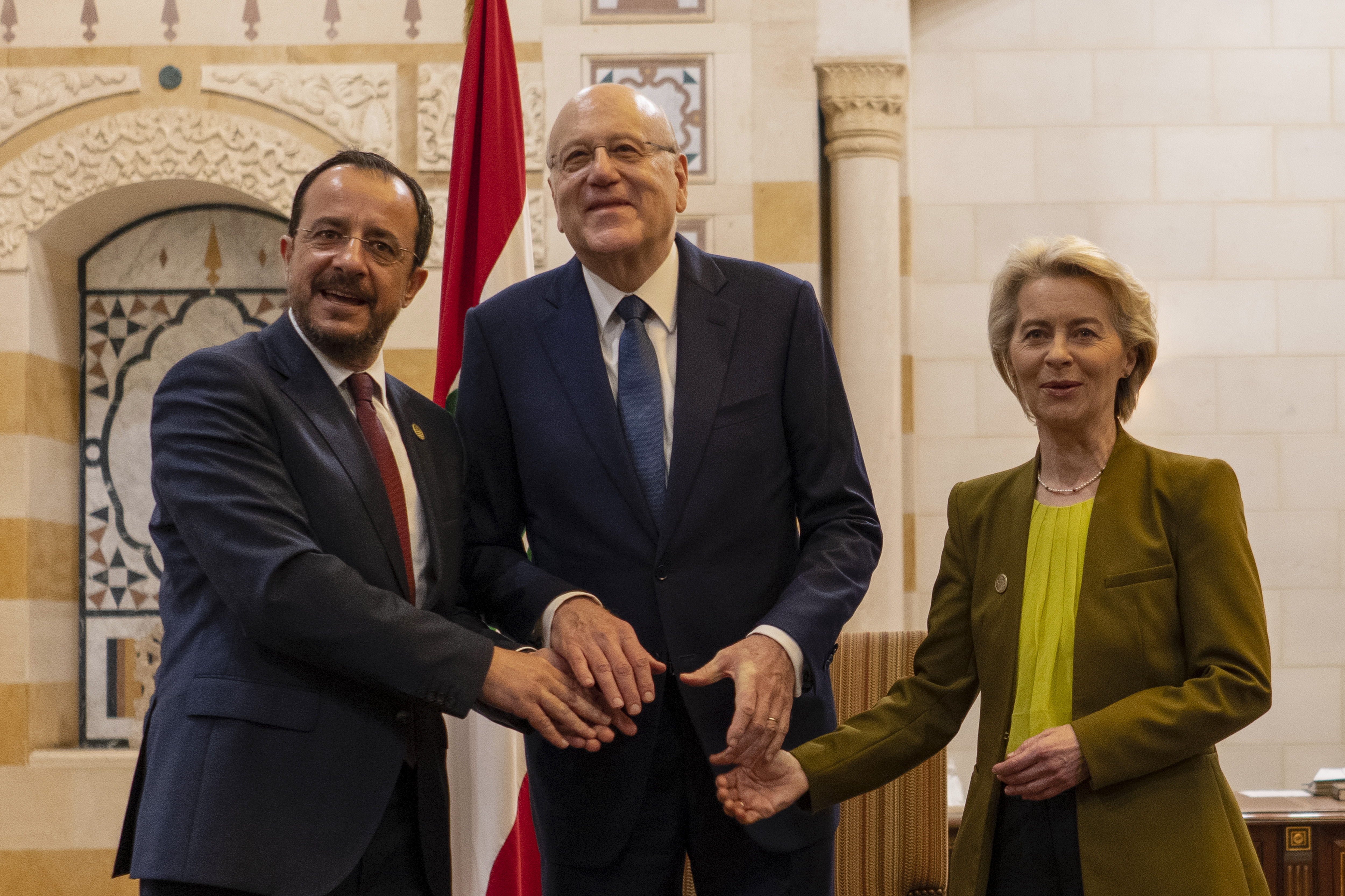 Mikati, Cypriot president and von der Leyen smiling and clasping hands