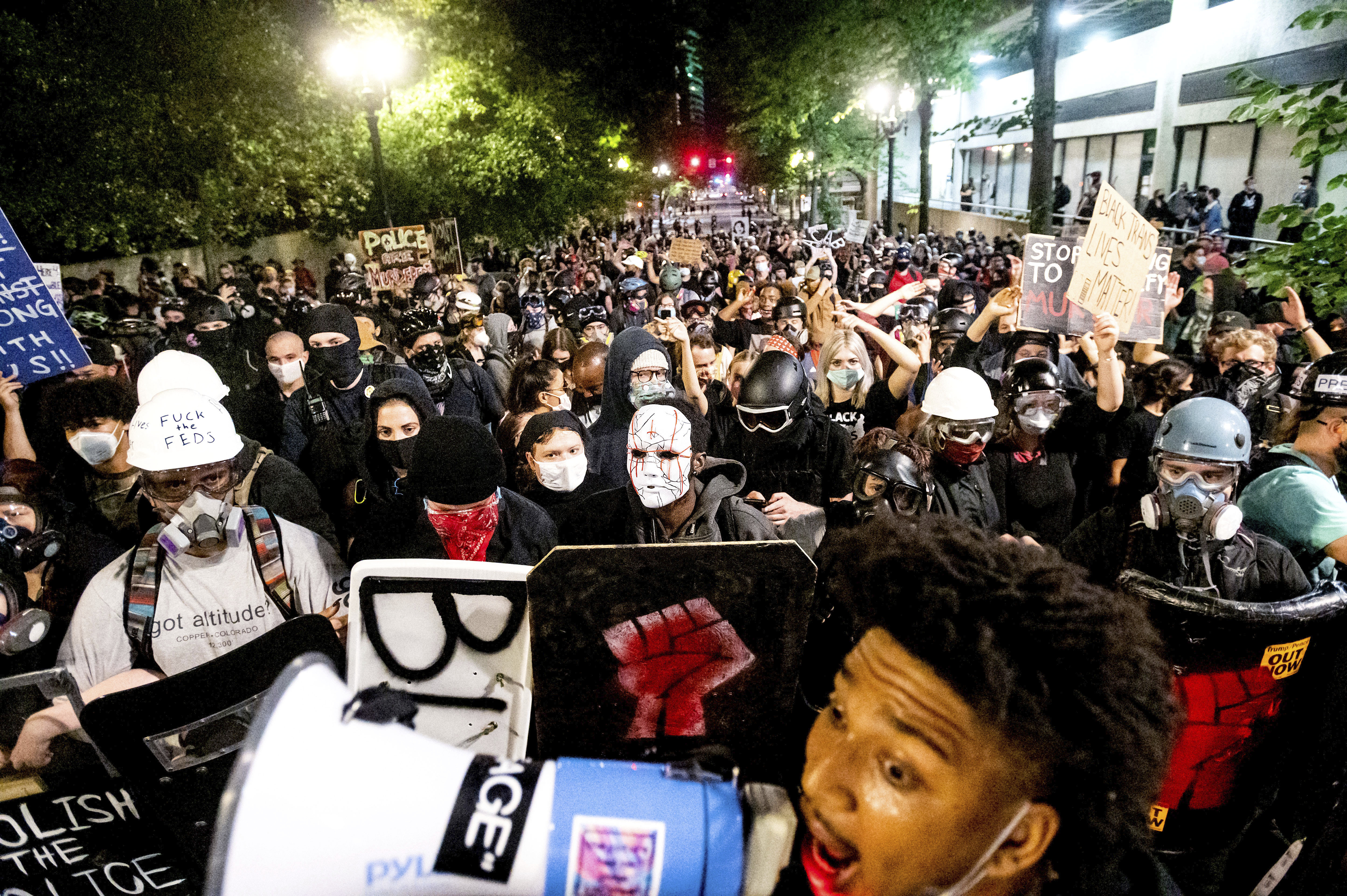 FILE - Black Lives Matter protesters march through Portland, Ore. after rallying at the Mark O. Hatfield United States Courthouse on Sunday, Aug. 2, 2020