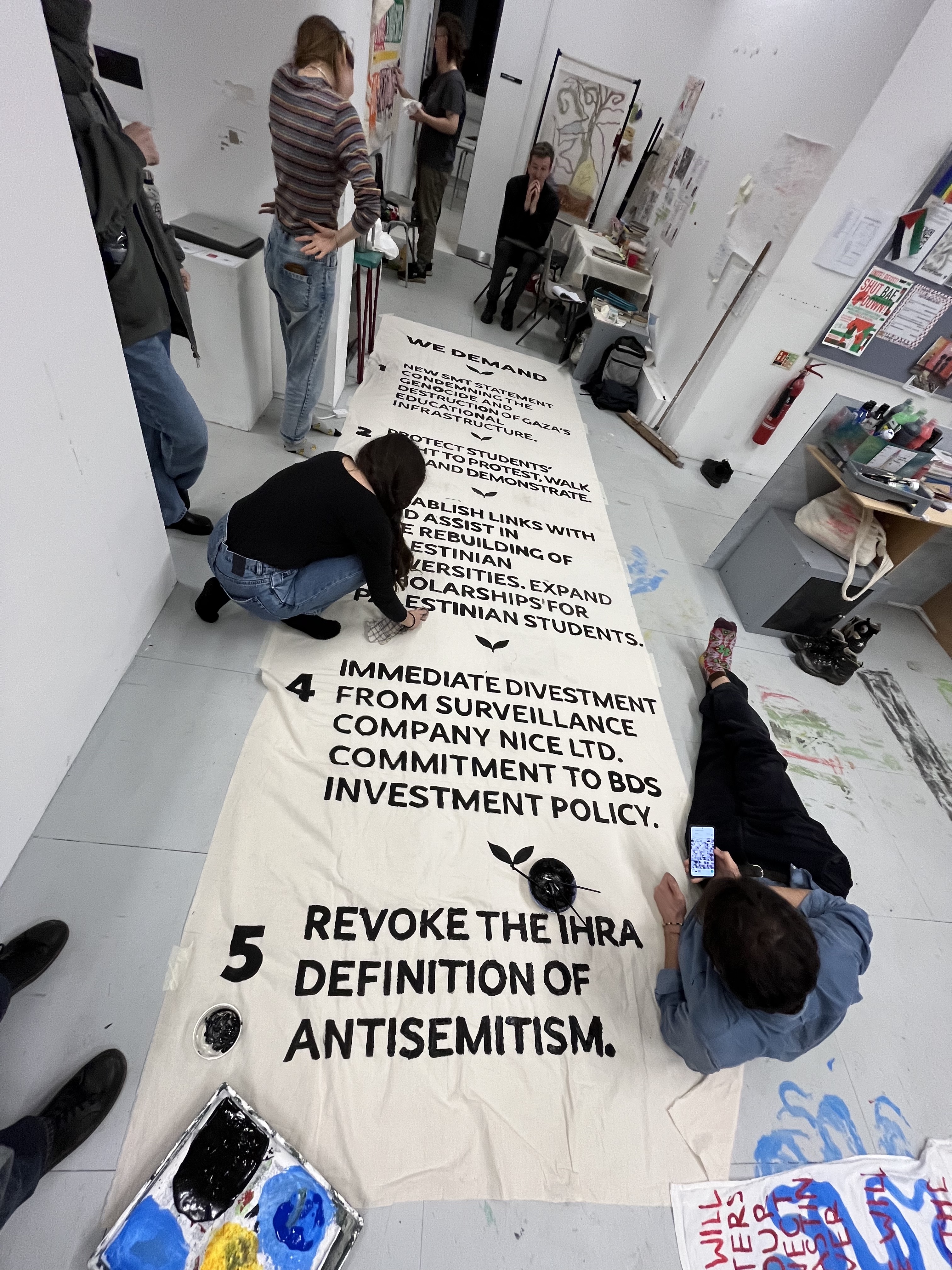 Students creating their banner of demands 19th February