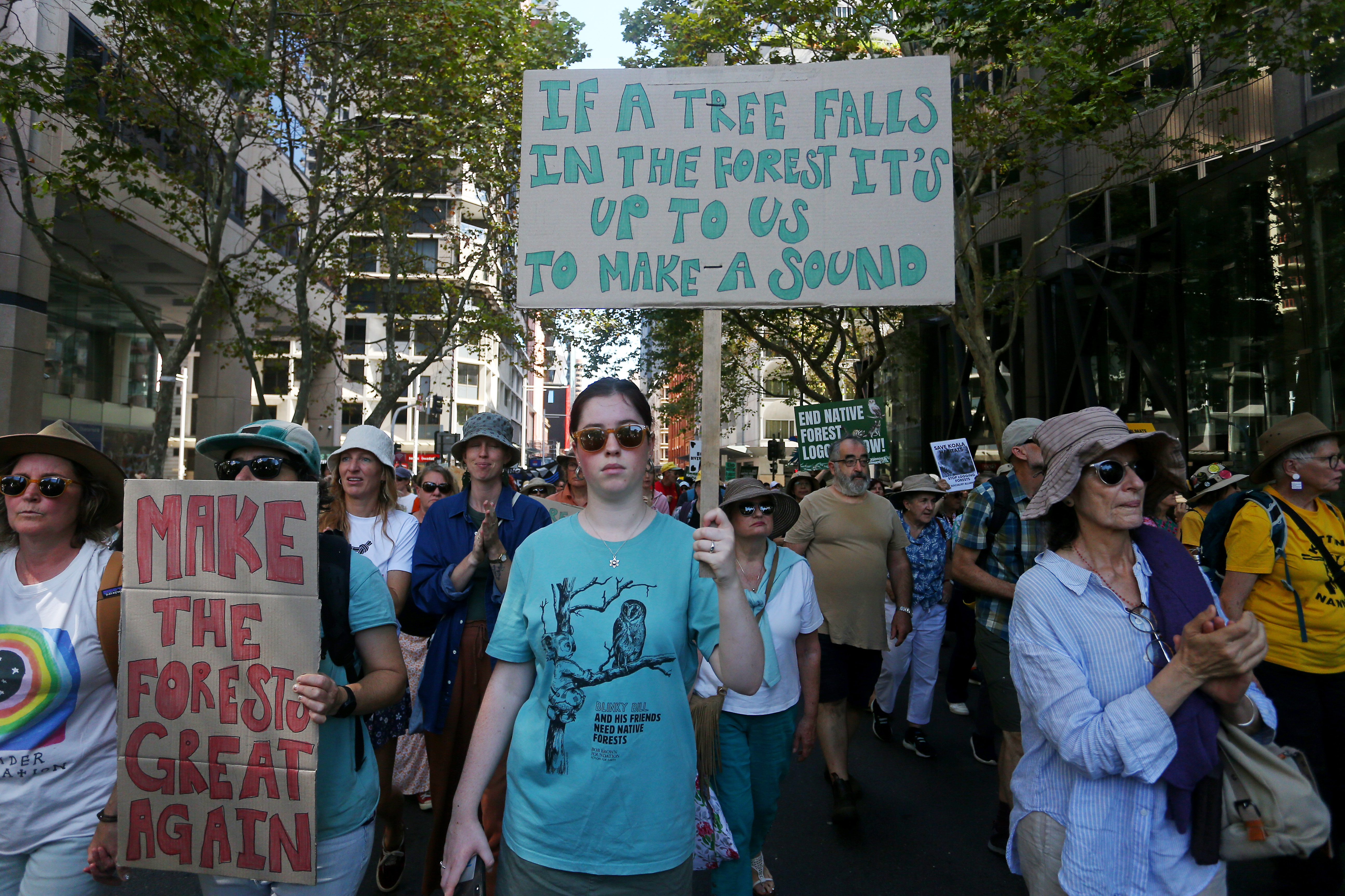 Activists take part in "March In March For Forests" on March 24, 2024 in Sydney, Australia. The "March in March for Forests" is a nationwide mass mobilisation event organised by the Bob Brown Foundation to advocate for the protection of native forests. This event aims to raise awareness about the urgent need to end native forest logging and promote conservation efforts to safeguard wild nature and biodiversity. [Lisa Maree Williams/Getty Images]