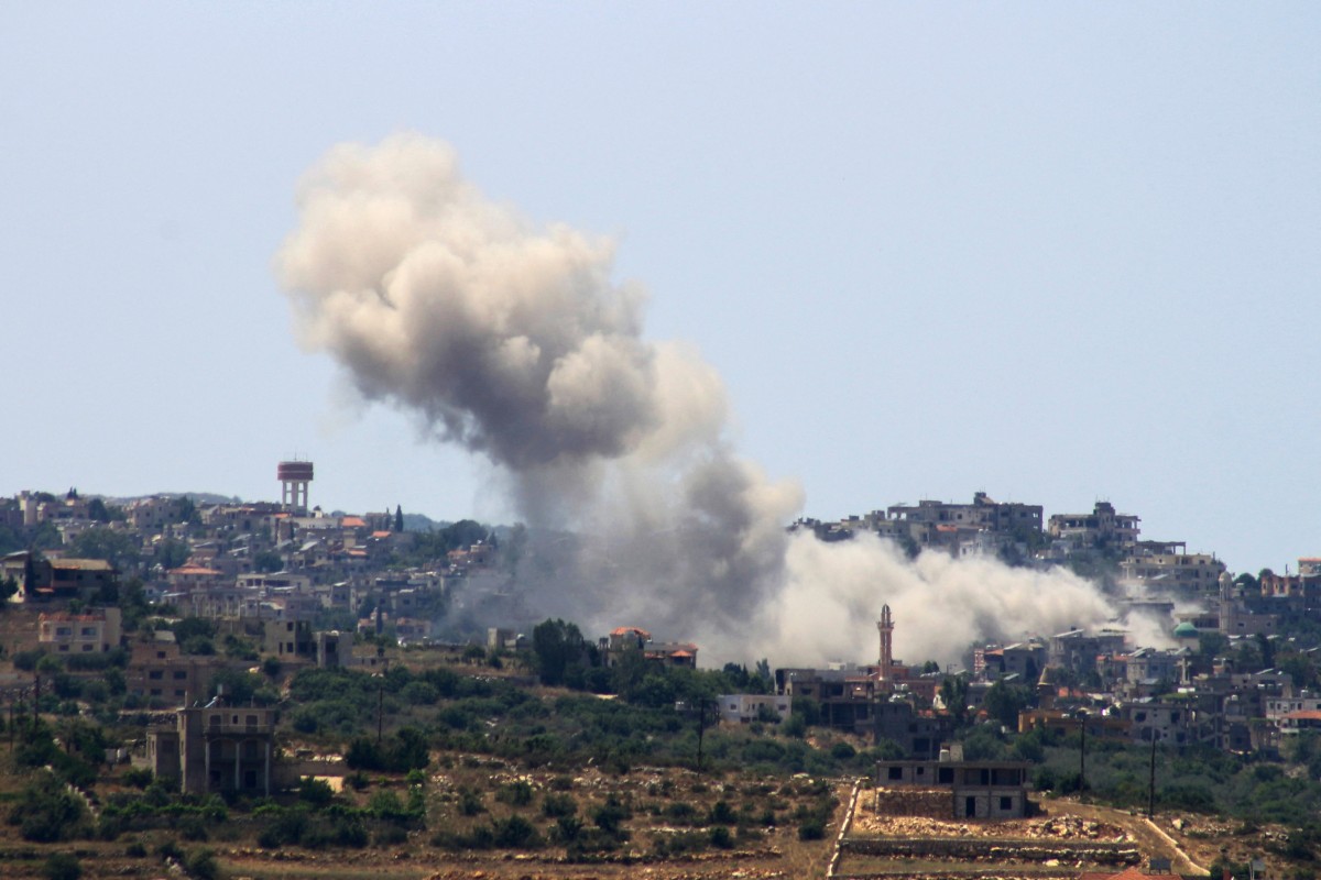Smoke billows from the site of an Israeli airstrike on the southern Lebanese village of Aita al Shaab