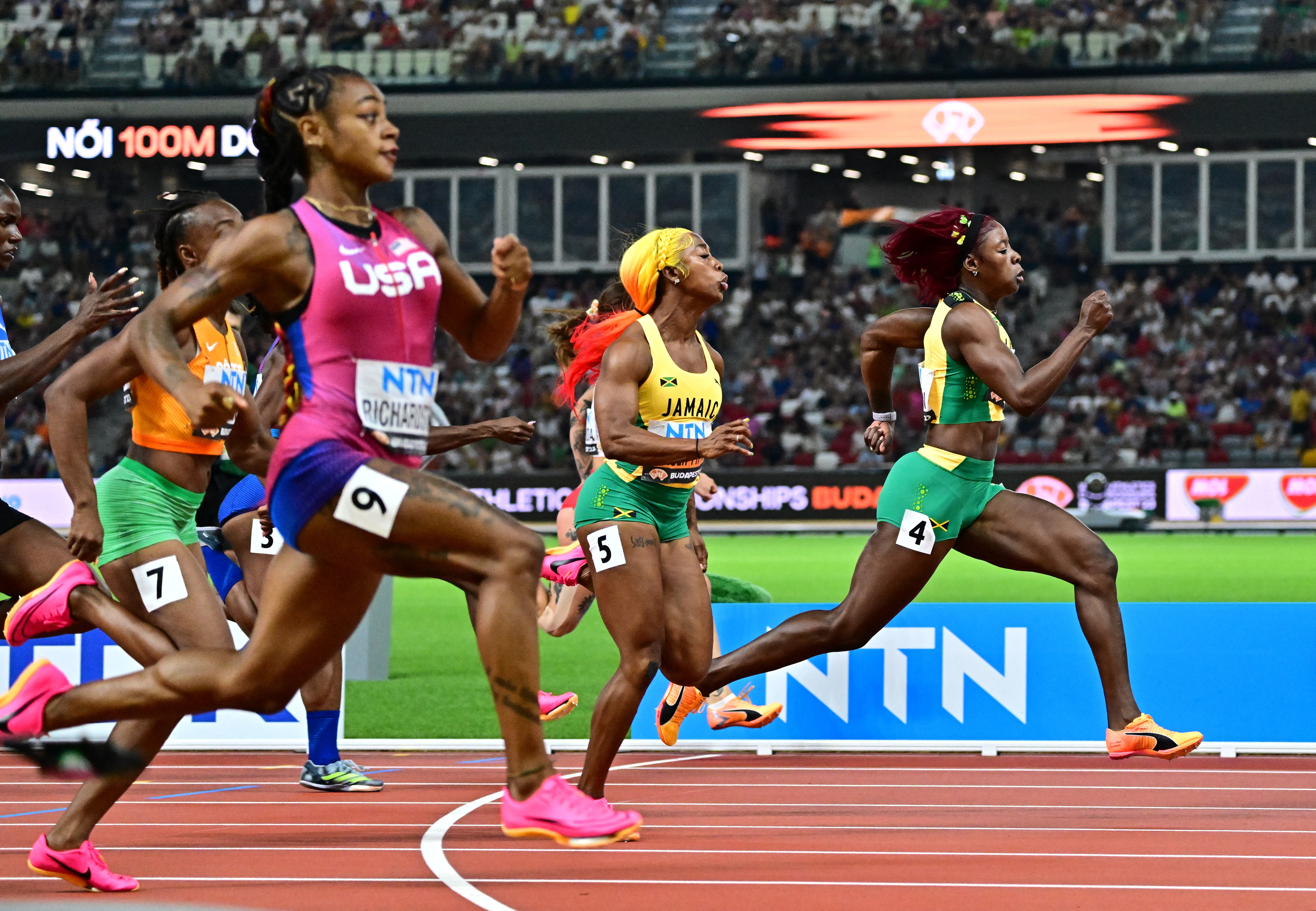 Female sprinters on track.