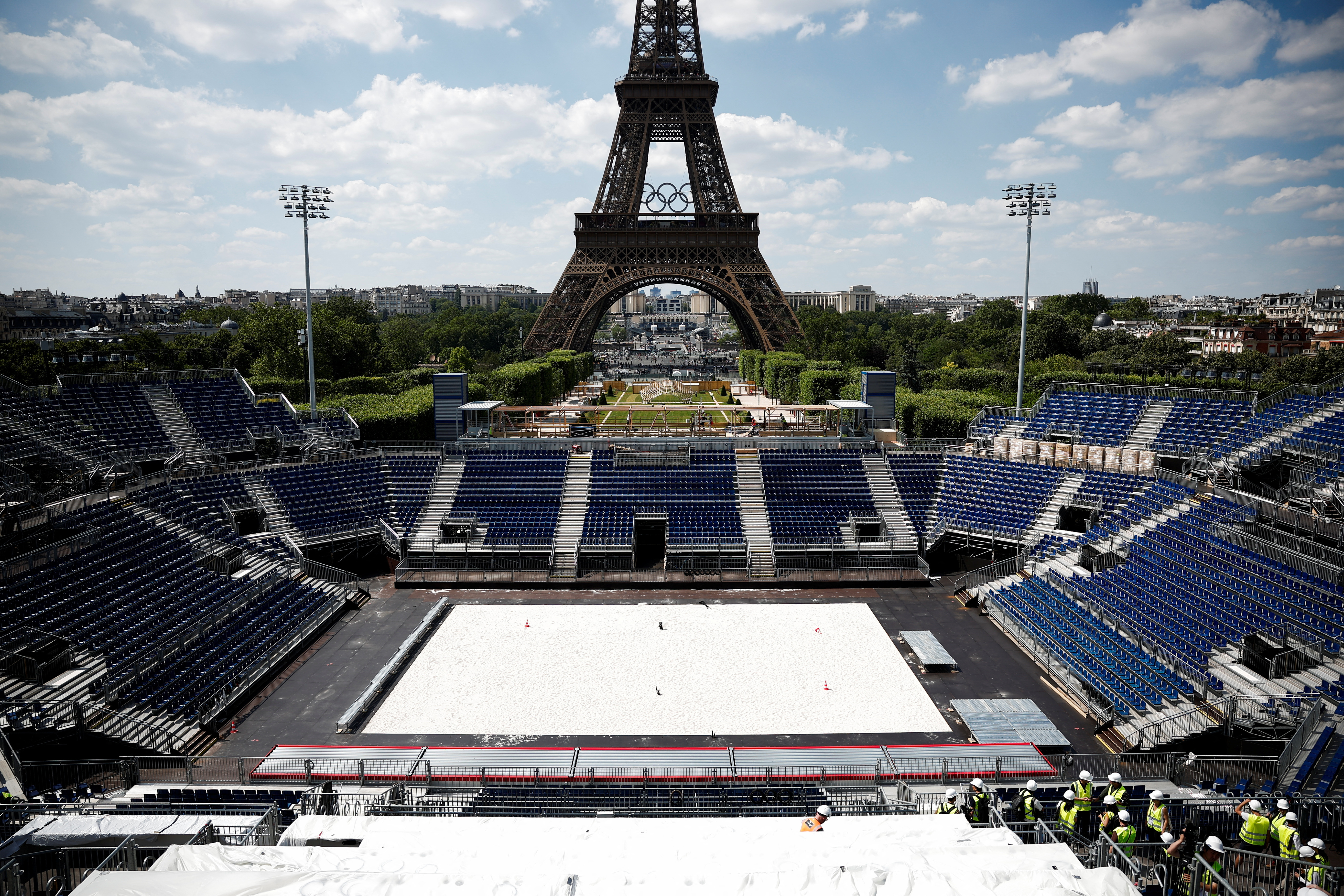 Volleyball court being built in front of Eiffel Tower.