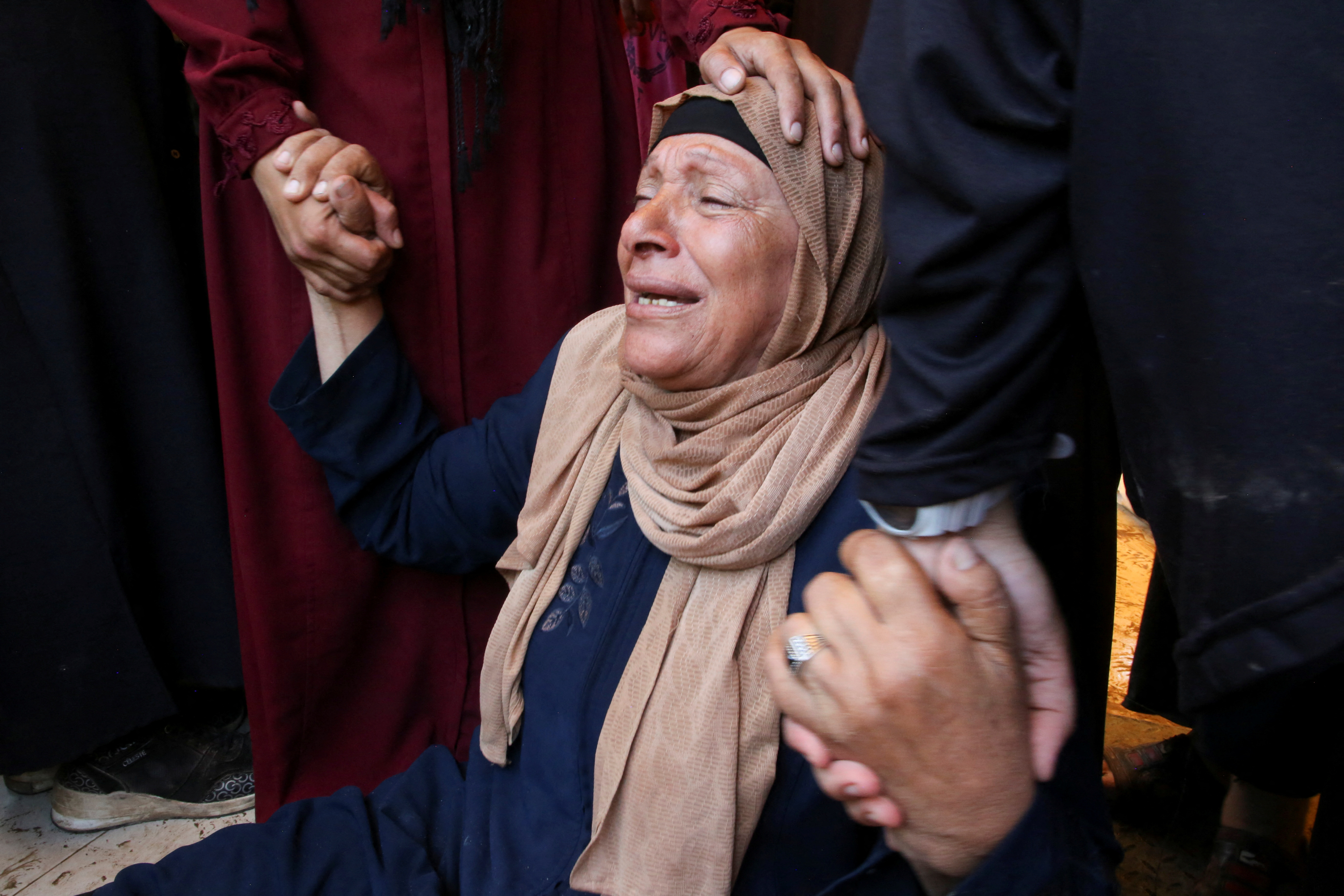 A woman mourns at Nasser hospital