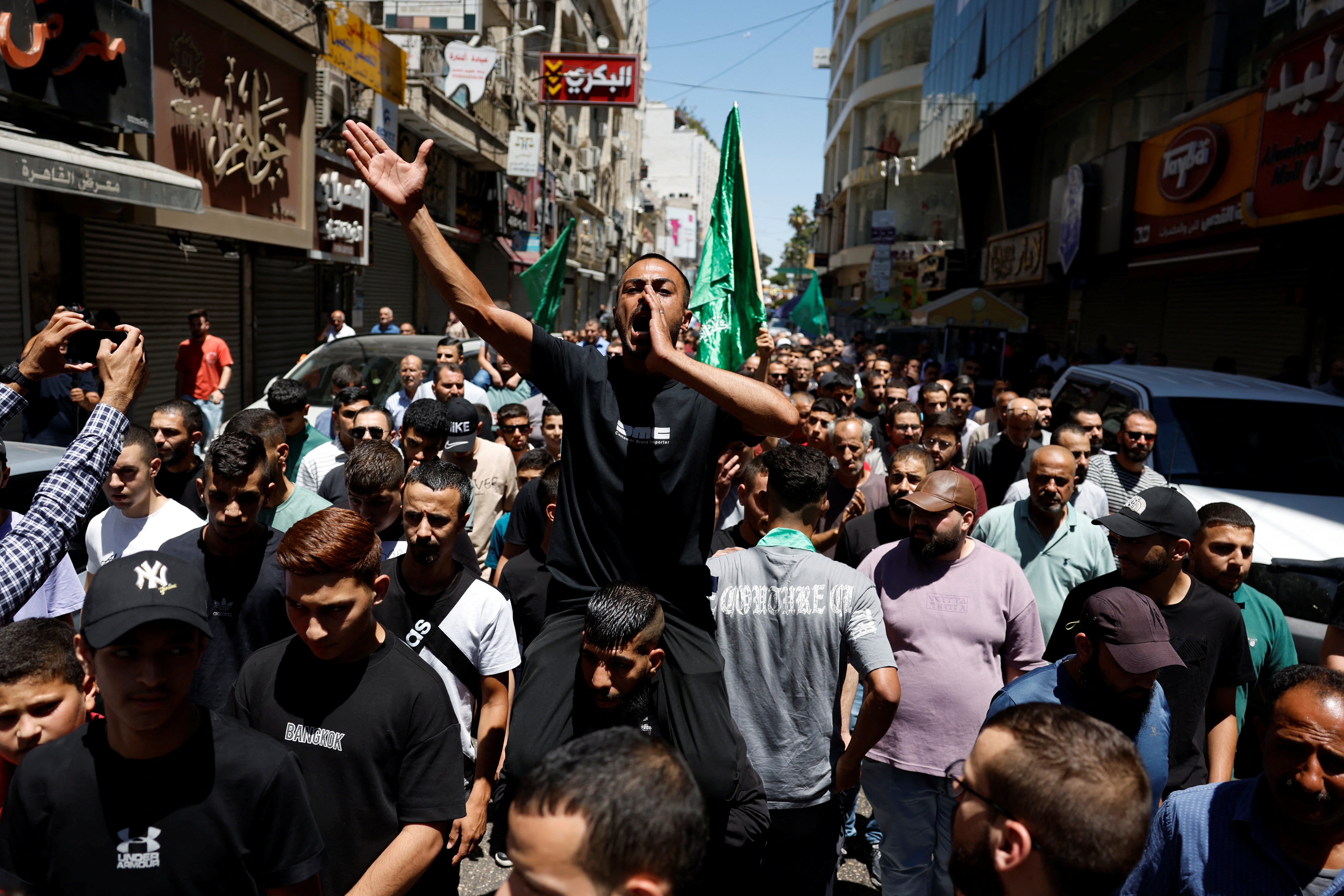 Palestinians attend a protest after the assassination of Hamas leader Ismail Haniyeh in Iran, in Ramallah