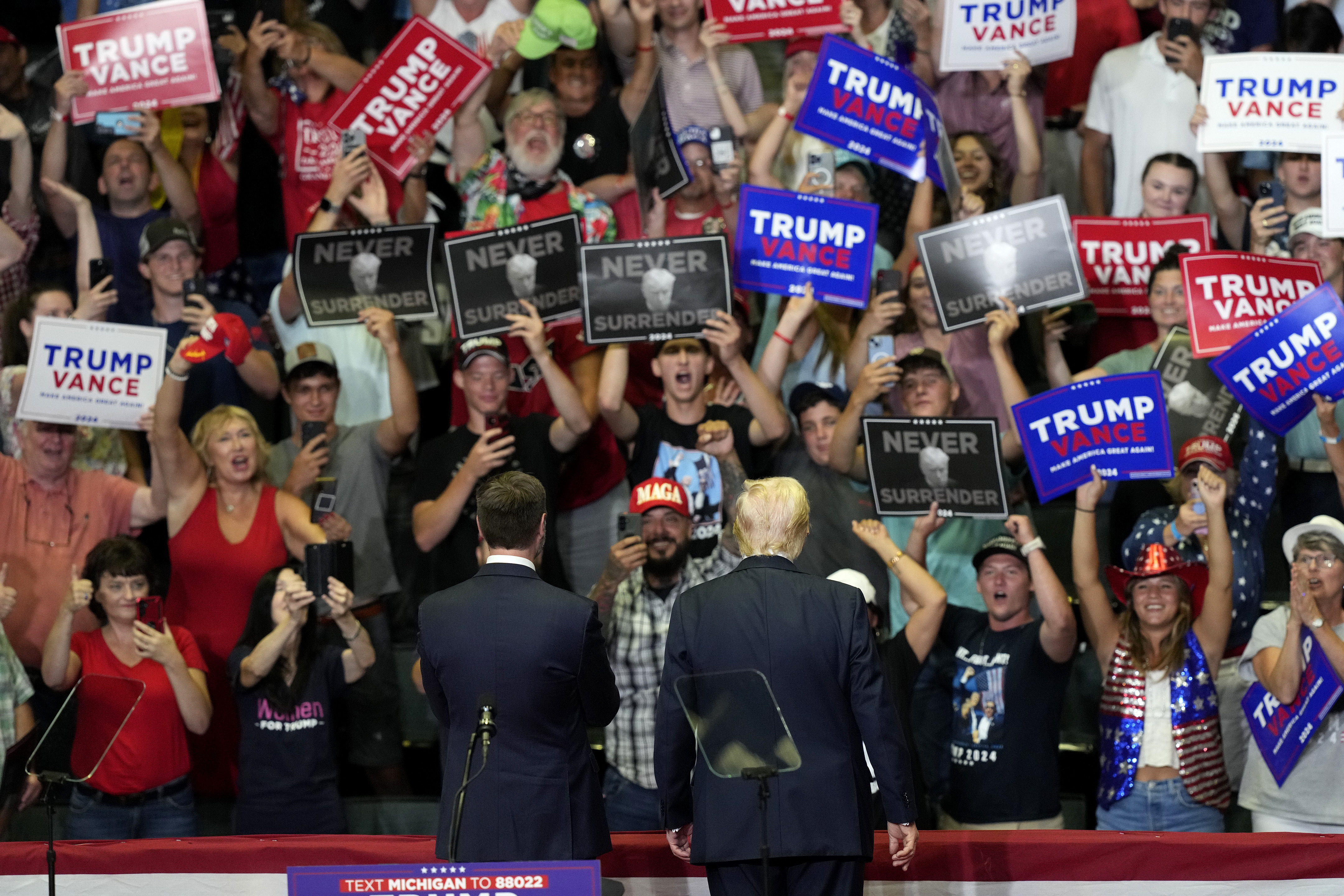 Republican presidential candidate former President Donald Trump, right, and Republican vice presidential candidate Sen. JD Vance, R-Ohio, attend a campaign event, Saturday, July 20, 2024, at Van Andel Arena in Grand Rapids, Mich.