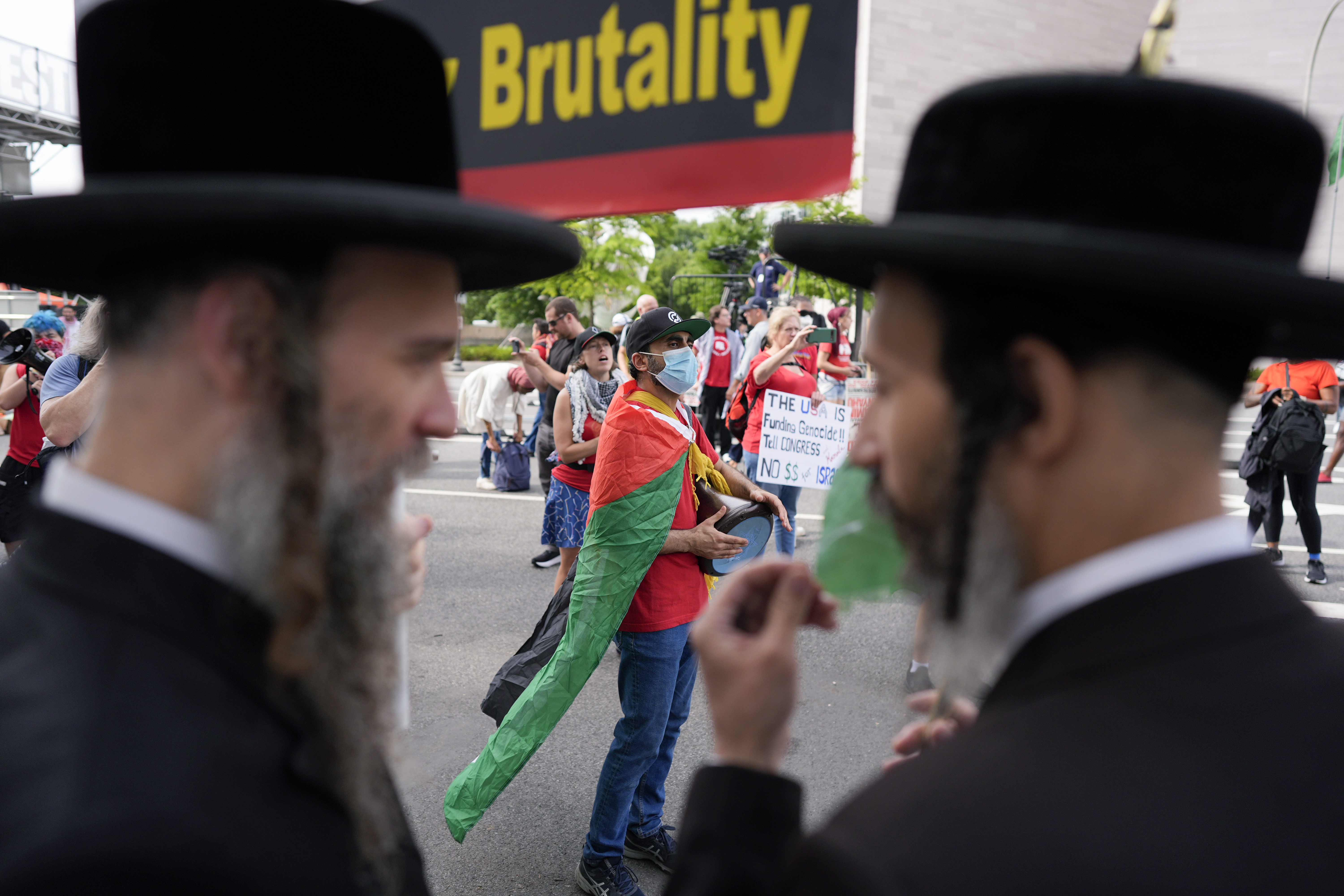Hasidic Jews and others are seen protesting against Netanyahu polices towards the Palestinians, near the US Capitol ahead of a scheduled visit by Israeli Prime Minister Benjamin Netanyahu