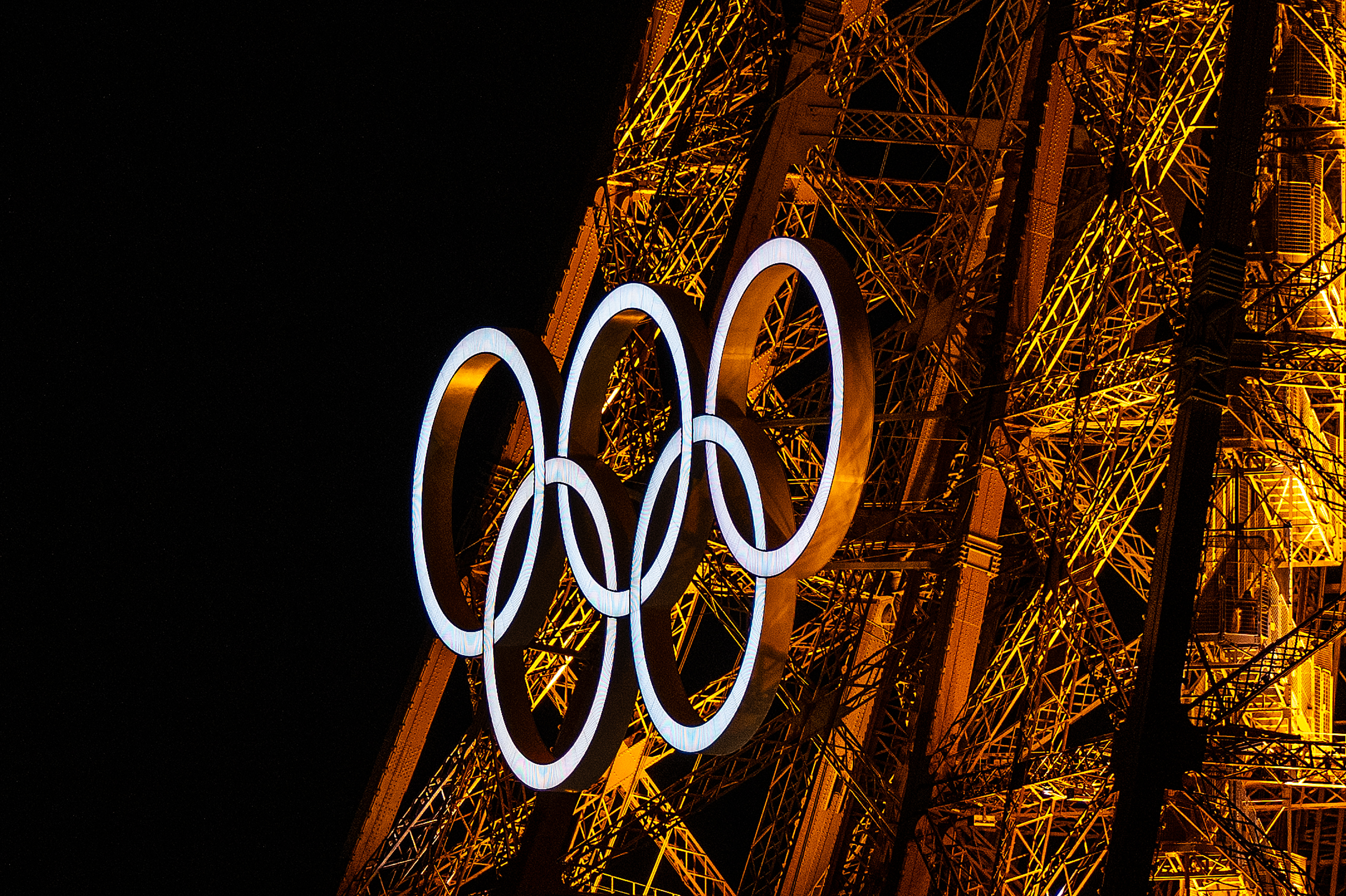 Olympic rings displayed on Eiffel Tower.