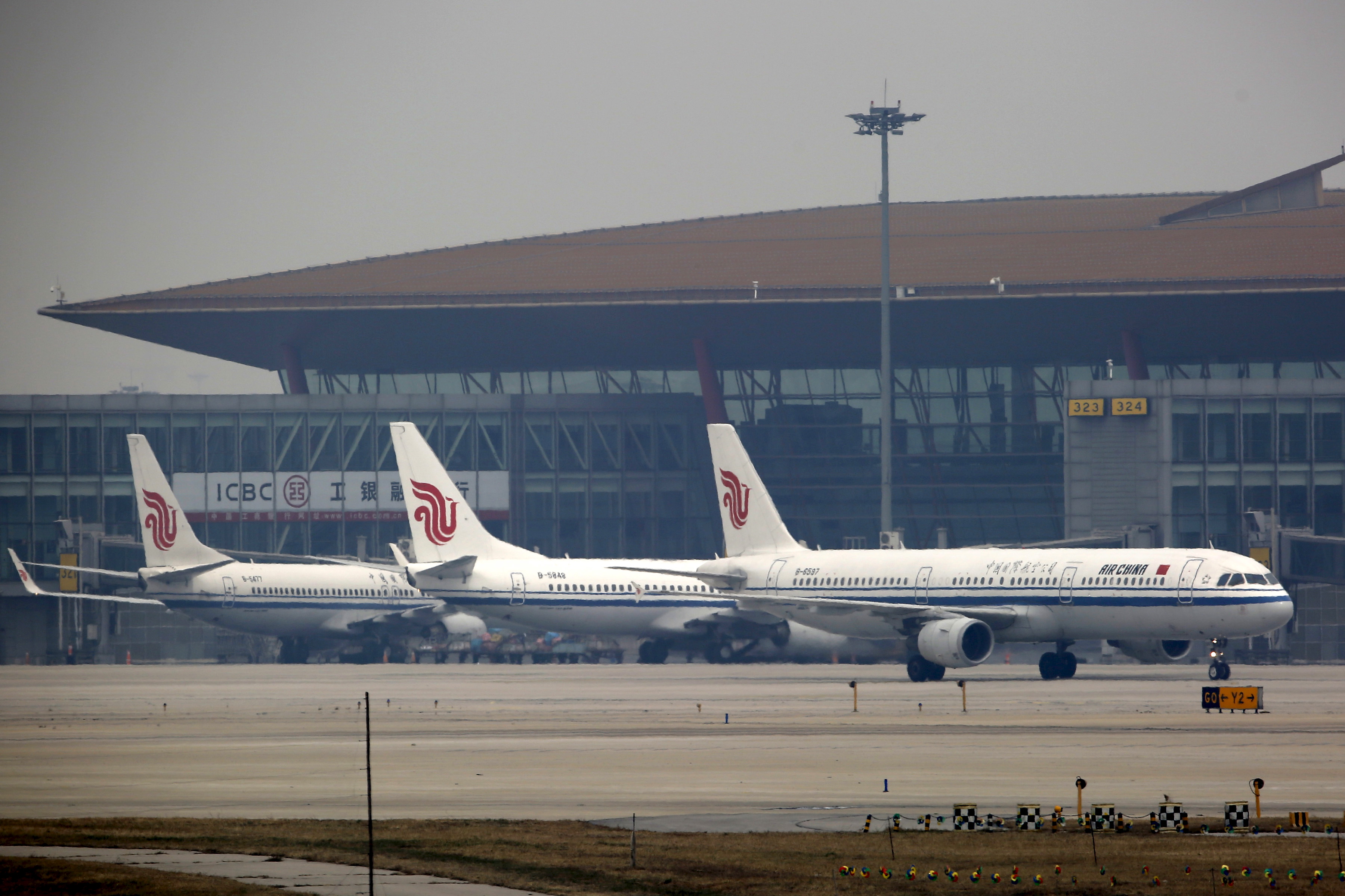 Planes belonging to Air China are parked on the tarmac of Beijing Capital International Airport in Beijing, China