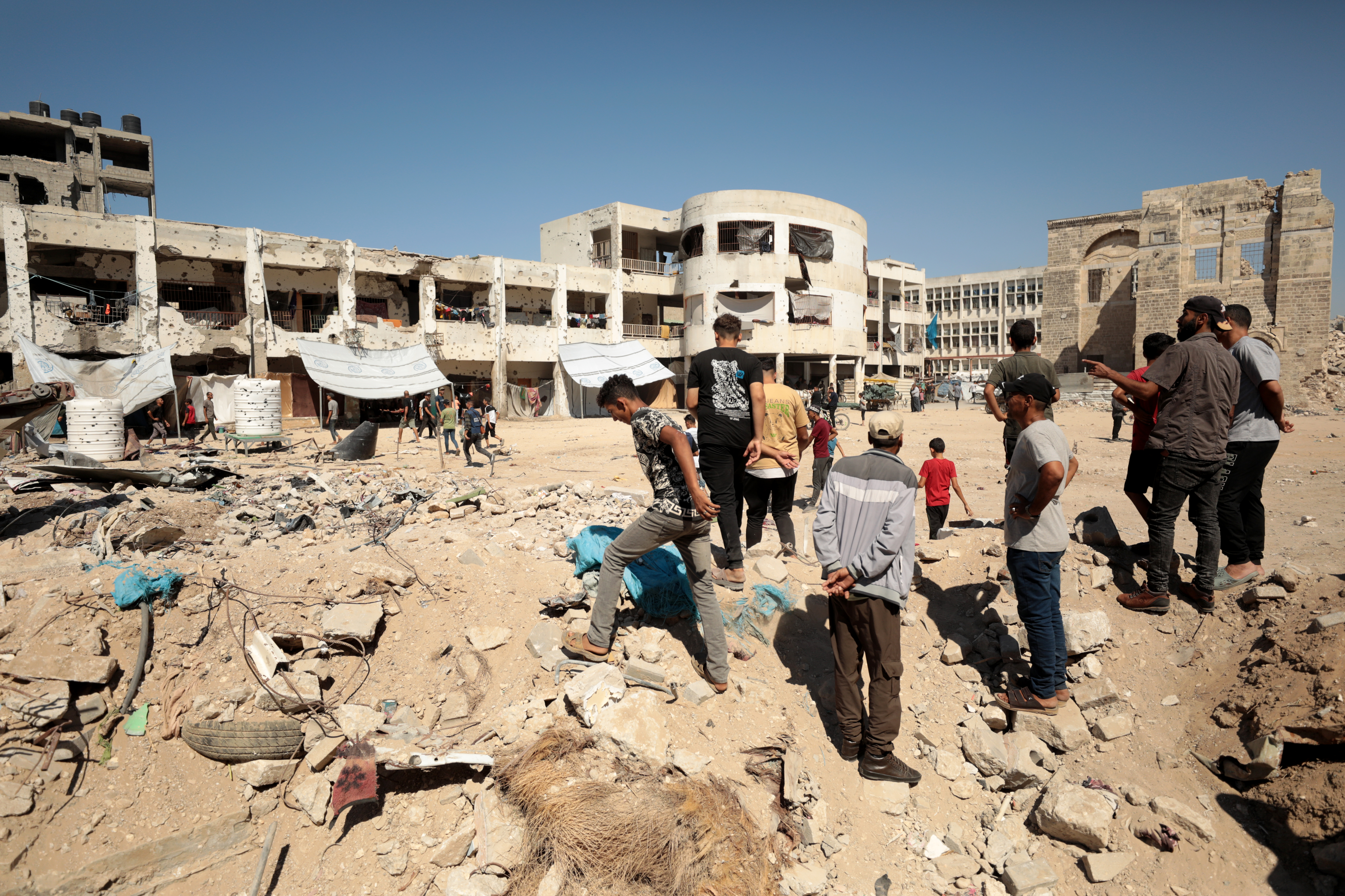 GAZA CITY, GAZA - AUGUST 08: Palestinians inspect the area after Israeli attack hit al-Zahraa School in the east of Gaza City, Gaza on August 08, 2024. It was reported that several people were killed as a result of the attack. ( Dawoud Abo Alkas - Anadolu Agency )