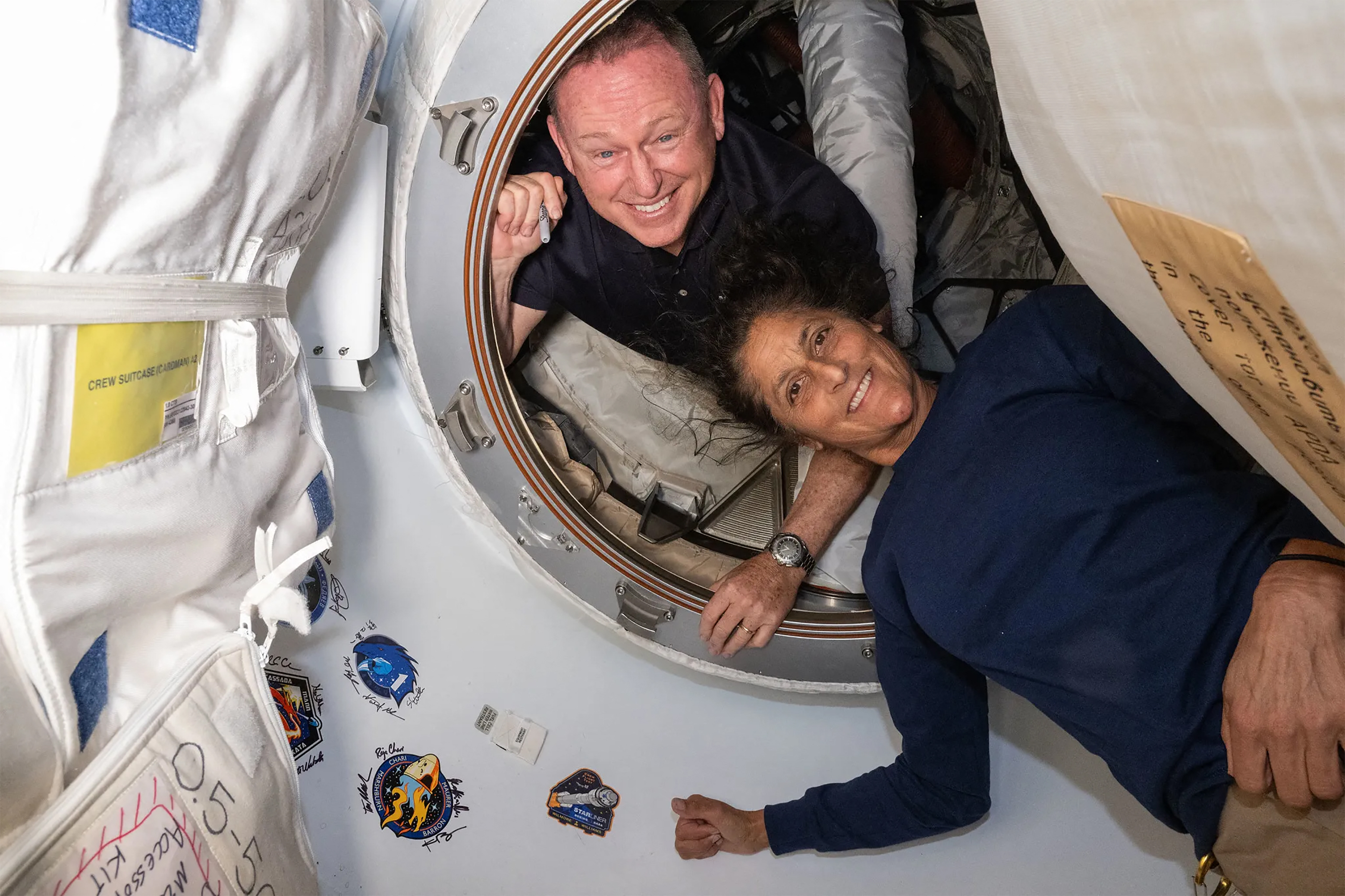 Butch Wilmore and Suni Williams smiling on board the ISS.