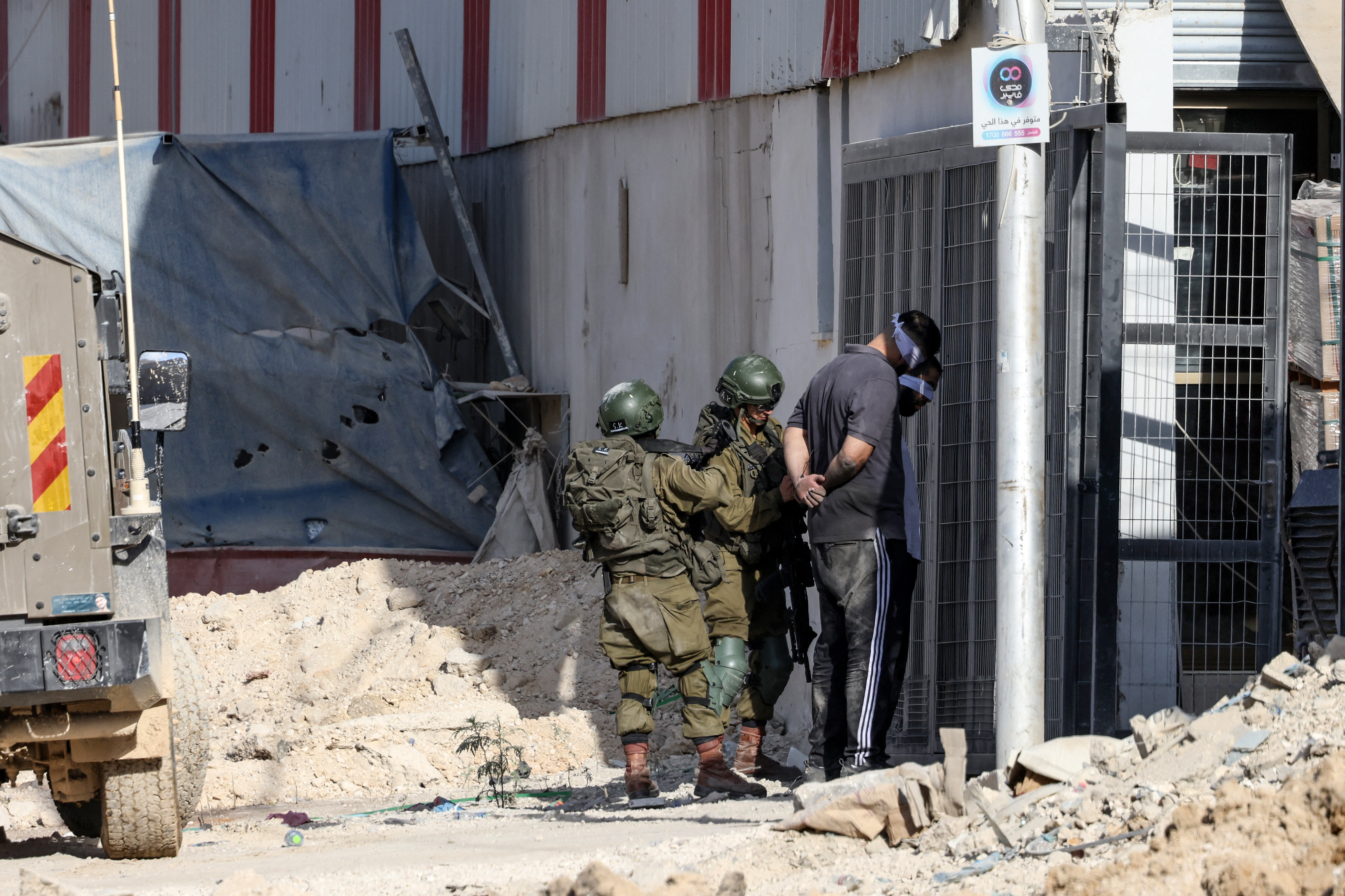 The largest Israeli military raid on the occupied West Bank in decades continues with at least 12 Palestinians killed and dozens wounded after the first day of the incursion on Wednesday.