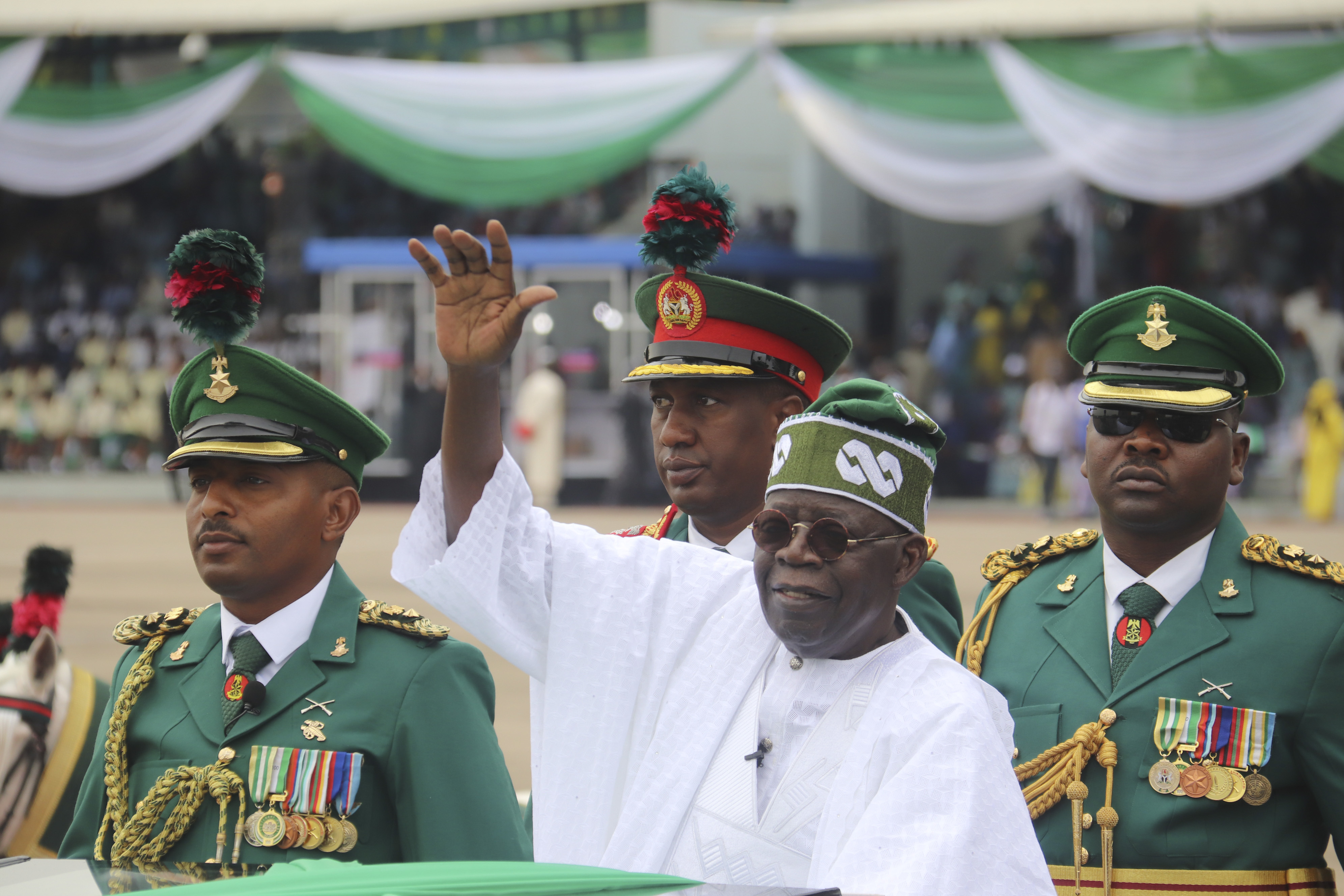 Nigeria National Anthem FILE - Nigeria's new President Bola Ahmed Tinubu, inspects honor guards after taking an oath of office at a ceremony in Abuja, Nigeria, on May 29, 2023. Nigeria adopted a new national anthem on Wednesday, May 29, 2024, after lawmakers passed a law that replaced the current one with a version dropped nearly 50 years ago, sparking widespread criticism about how the law was hastily passed without much public input.(AP Photo/Olamikan Gbemiga, File)