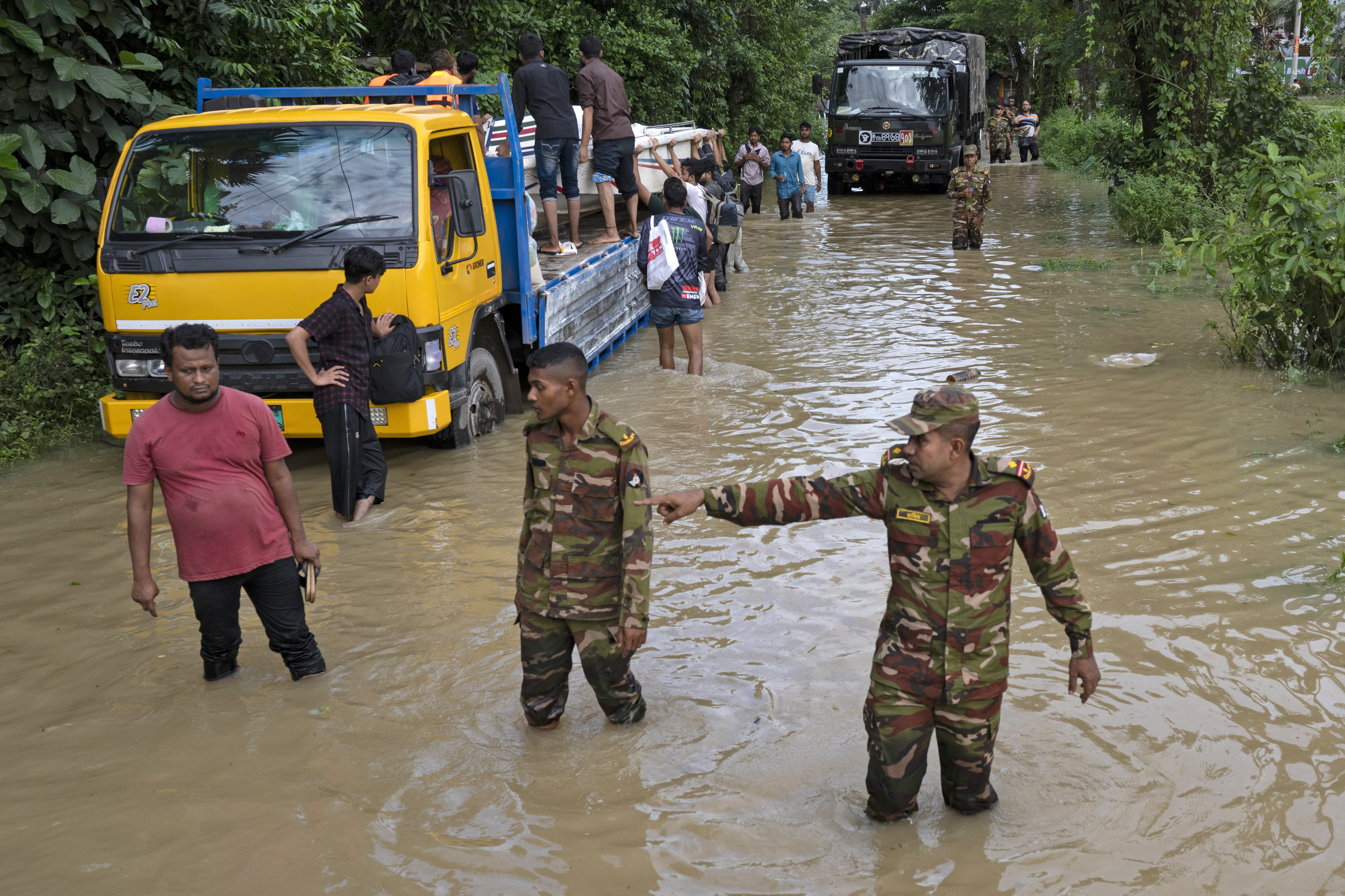 Bangladesh Army personnel direct a rescue operation