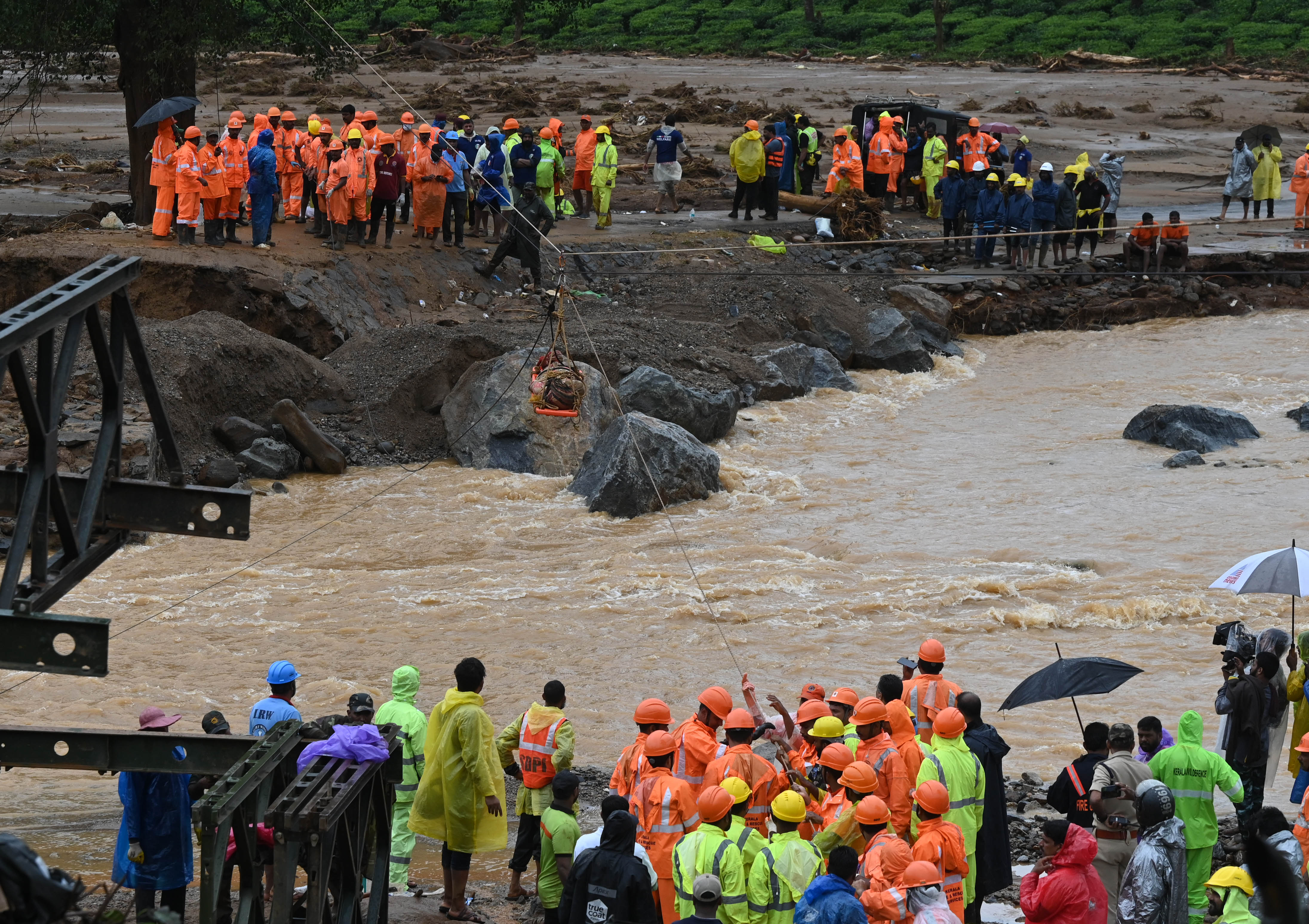 After the collapse of the bridge that connects landslide-hit Attamala and Chooralmala villages in Wayanad, rescue workers relied on ropes to carry retrieved bodies to the hospital for post-mortem. The issue was sorted with the construction of a Bailey bridge on Thursday. Photo/ TA Ameerudheen