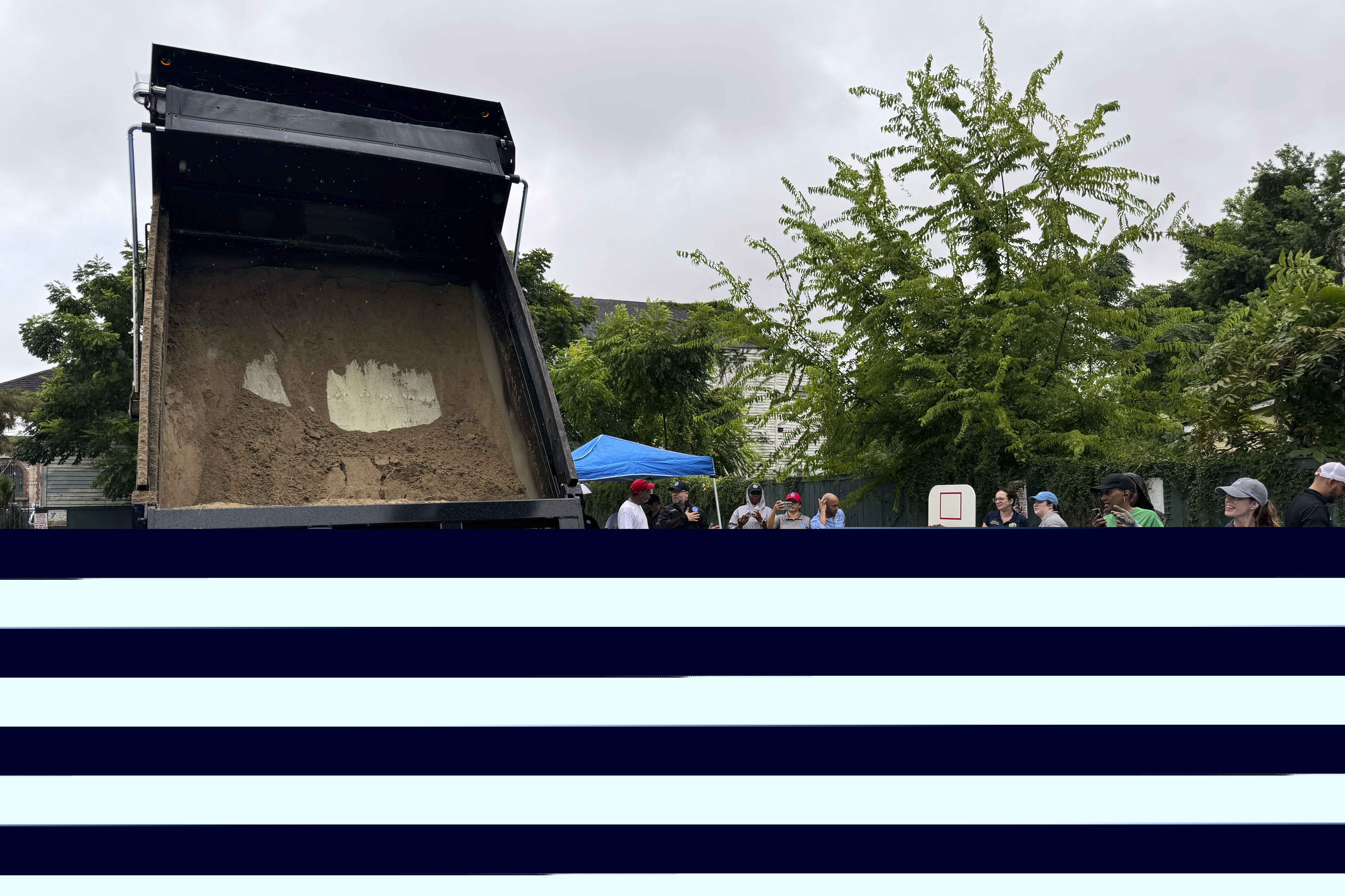 Residents fill up sand bags to protect their homes in anticipation of Tropical Storm Francine
