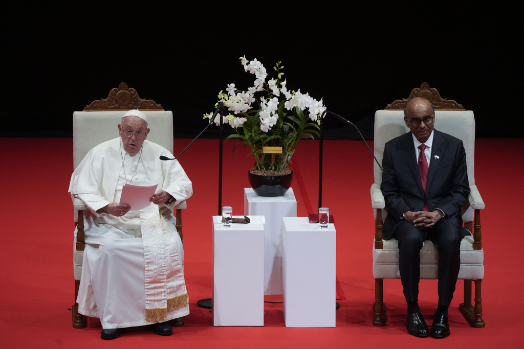 Pope Francis addresses Singapore's President Tharman Shanmugaratnam, right, and the audience during a meeting with the authorities, civil society and the diplomatic corps in the theatre of the Cultural Centre of the National University of Singapore