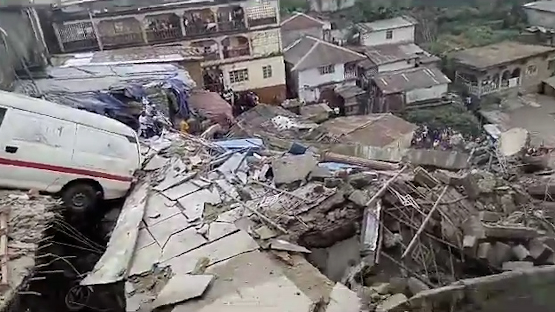 Scene of the collapsed seven storey building. (Al Jazeera)