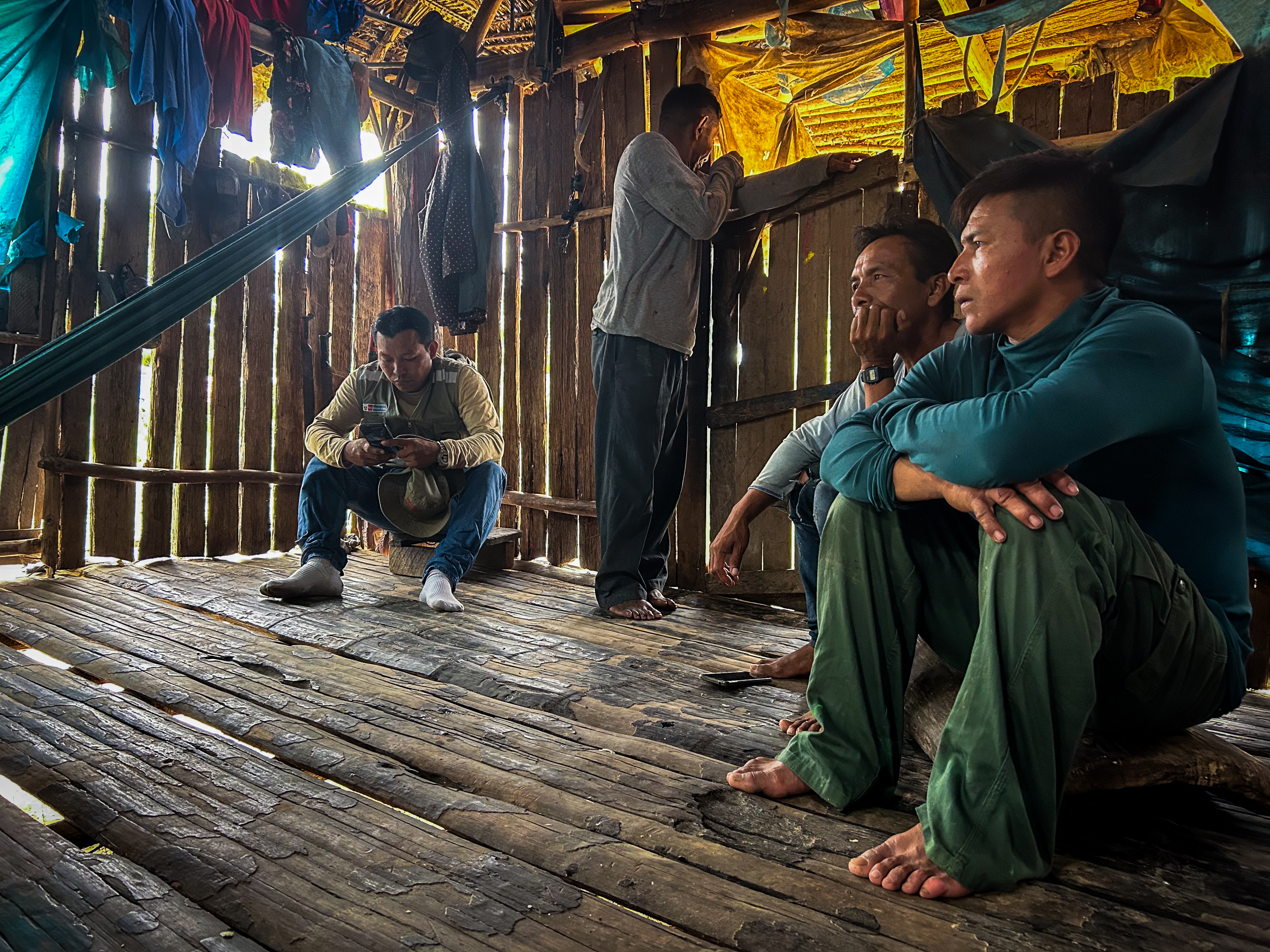 Protection agents outline emergency measures to villagers in Colombiana, which has had repeated contact with an isolated tribe [Neil Giardino/Al Jazeera]