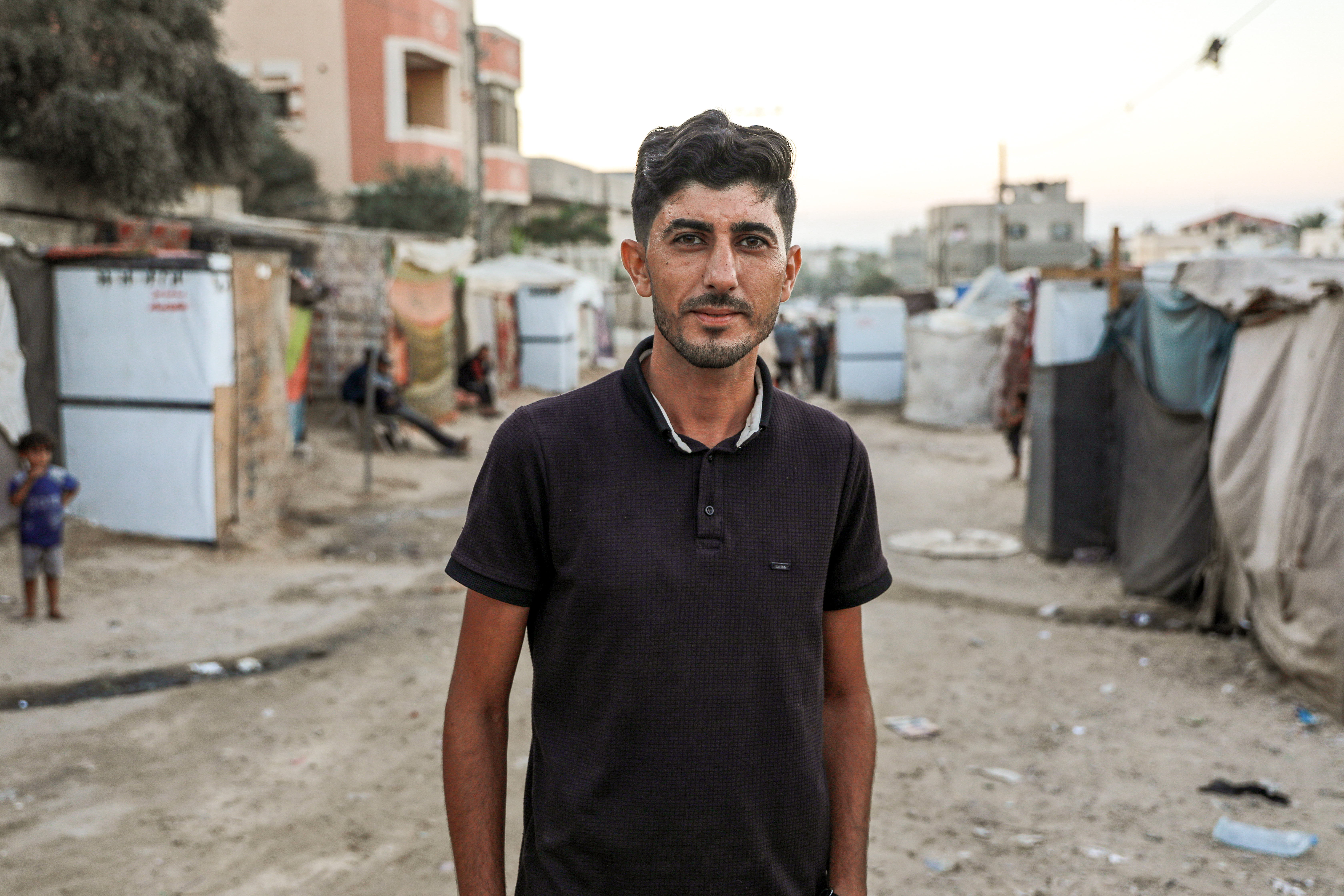 Ibrahim Rushdi spoke to Al Jazeera from a displacement camp in in Deir al-Balah as Israel's war on the people of Gaza continued [Abdelhakim Abu Riash/Al Jazeera]