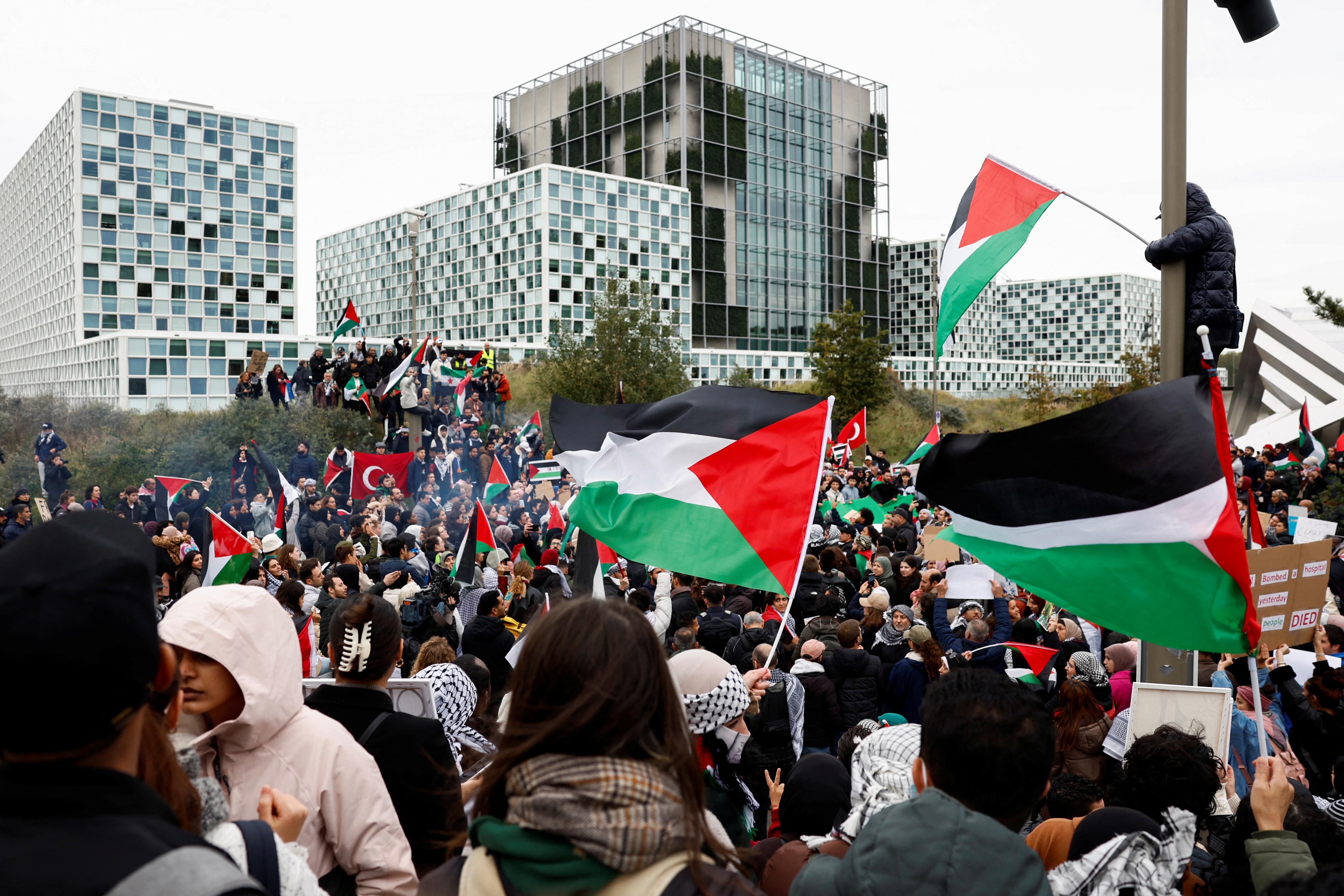 People protest in support of Palestinians in Gaza as the conflict between Israel and Hamas continues, at the headquarters of the International Criminal Court (ICC), which has ongoing investigations into potential atrocity crimes carried out by Hamas in Israel, and by Israelis in the Gaza Strip going back to 2014, and which also covers the current conflict, in The Hague, Netherlands October 18, 2023. REUTERS/Piroschka van de Wouw