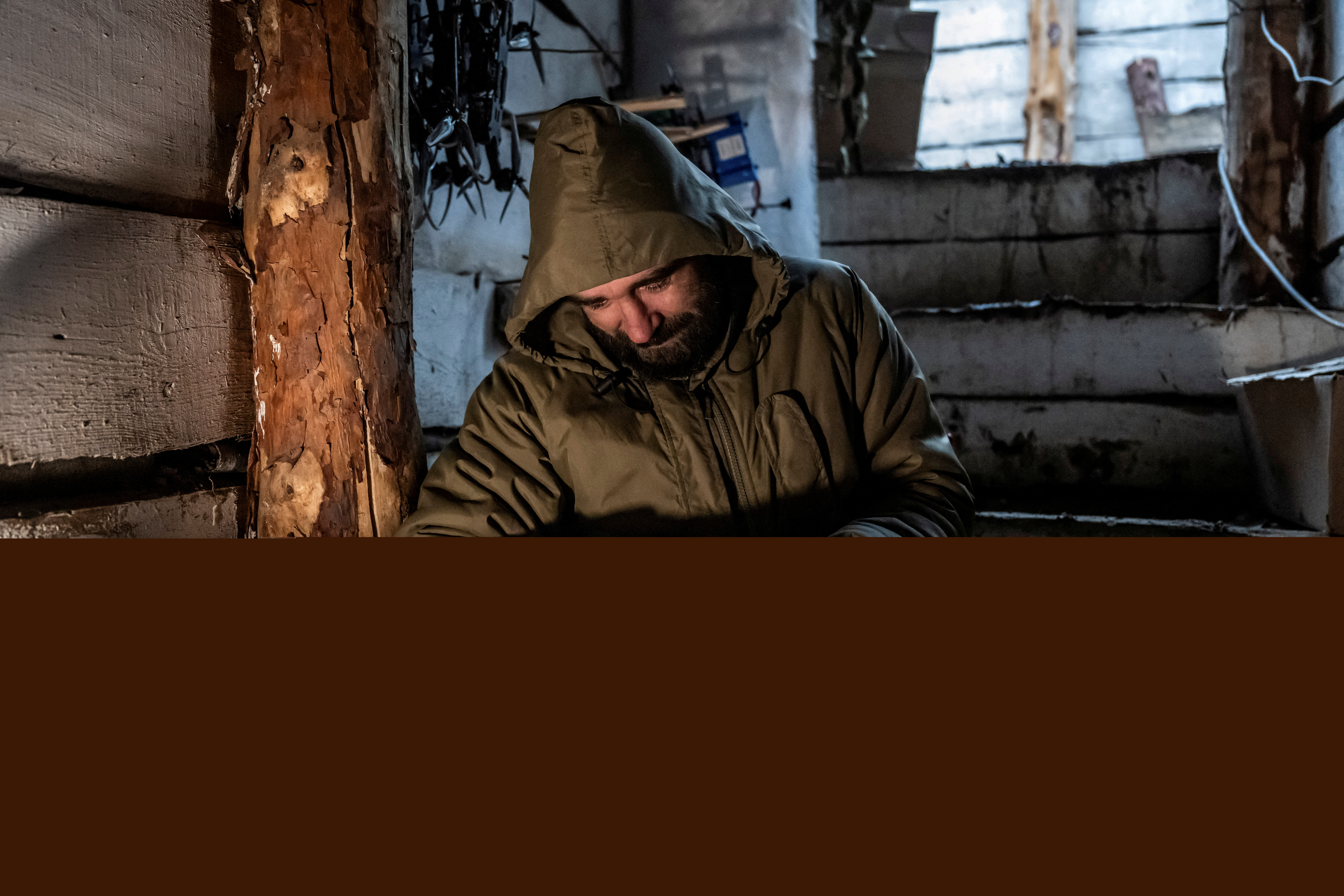 FILE PHOTO: A serviceman of Da Vinci Wolves Separate Mechanized Battalion, named after Dmytro Kotsiubailo, of the 59th mechanized brigade of the Ukrainian Armed Forces, attaches a shell to a first-person view (FPV) drone at his front line position, amid Russia's attack on Ukraine, near the town of Pokrovsk in Donetsk region, Ukraine October 20, 2024. REUTERS/Viacheslav Ratynskyi/File Photo