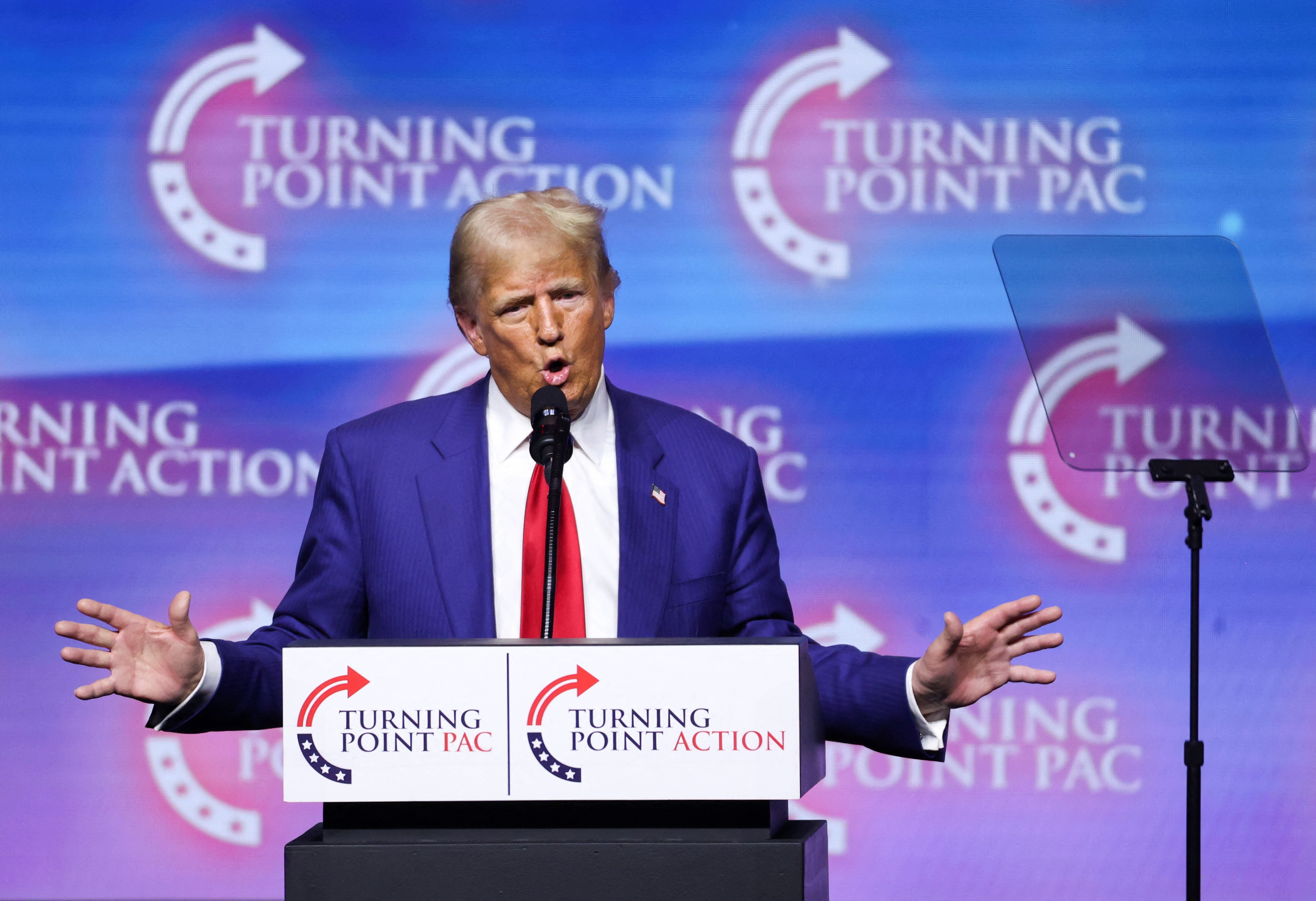 Donald Trump speaks at a podium in Nevada