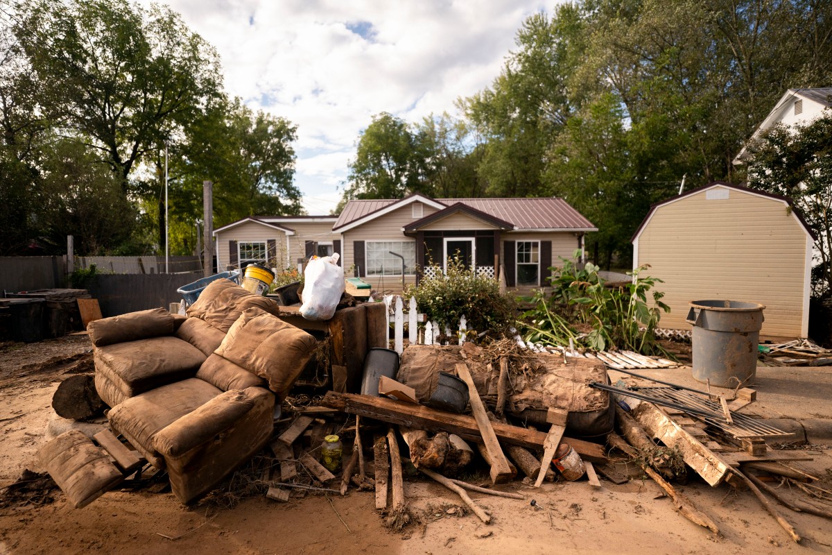 Damaged belongings sit along the road in the aftermath of Hurricane Helene on September 30, 2024 in Old Fort, North Carolina