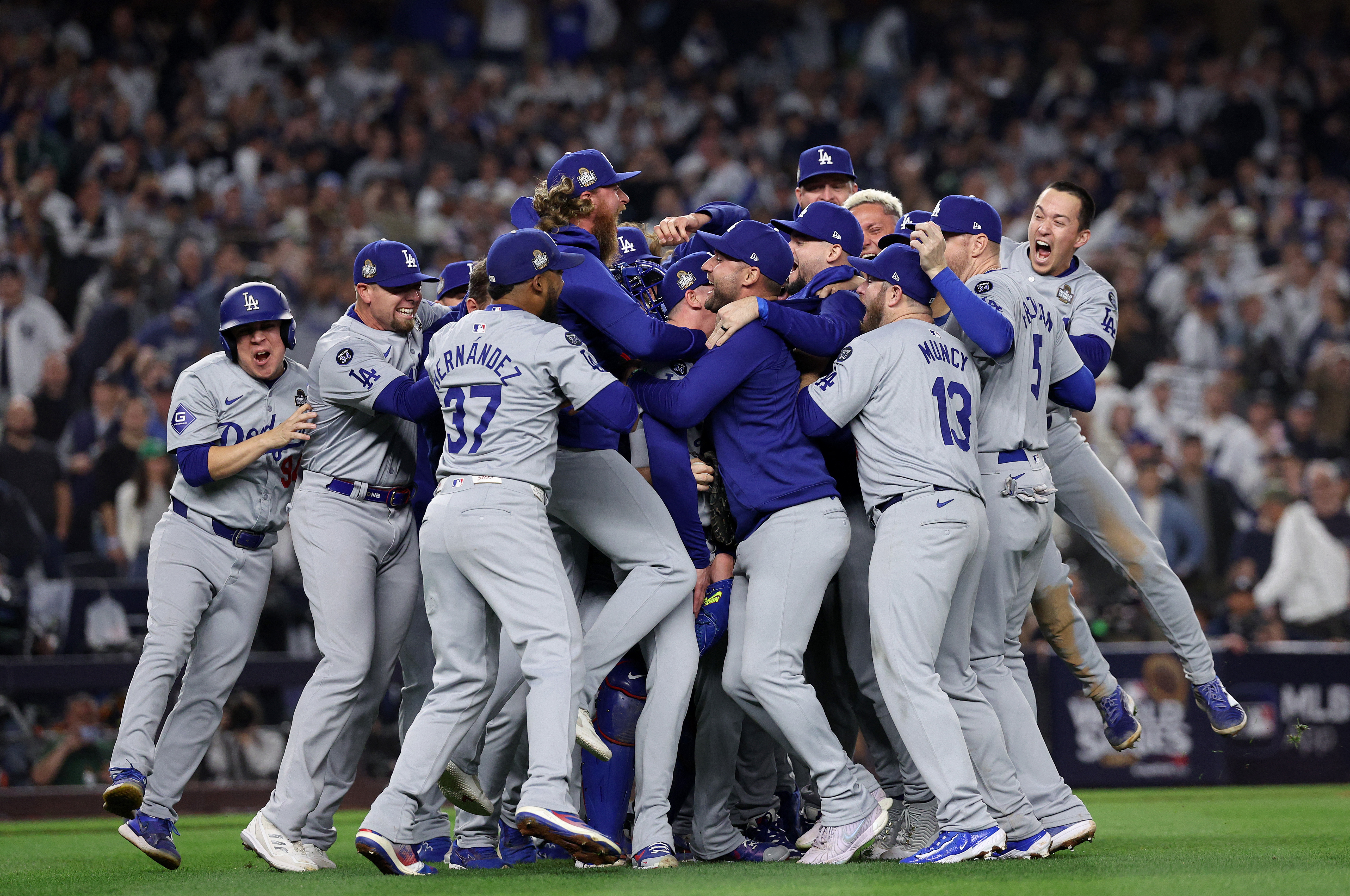 The Los Angeles Dodgers celebrate after defeating the New York Yankees 7-6 in Game 5 to win the 2024 World Series at Yankee Stadium on October 30, 2024 [Elsa/Getty Images via AFP]