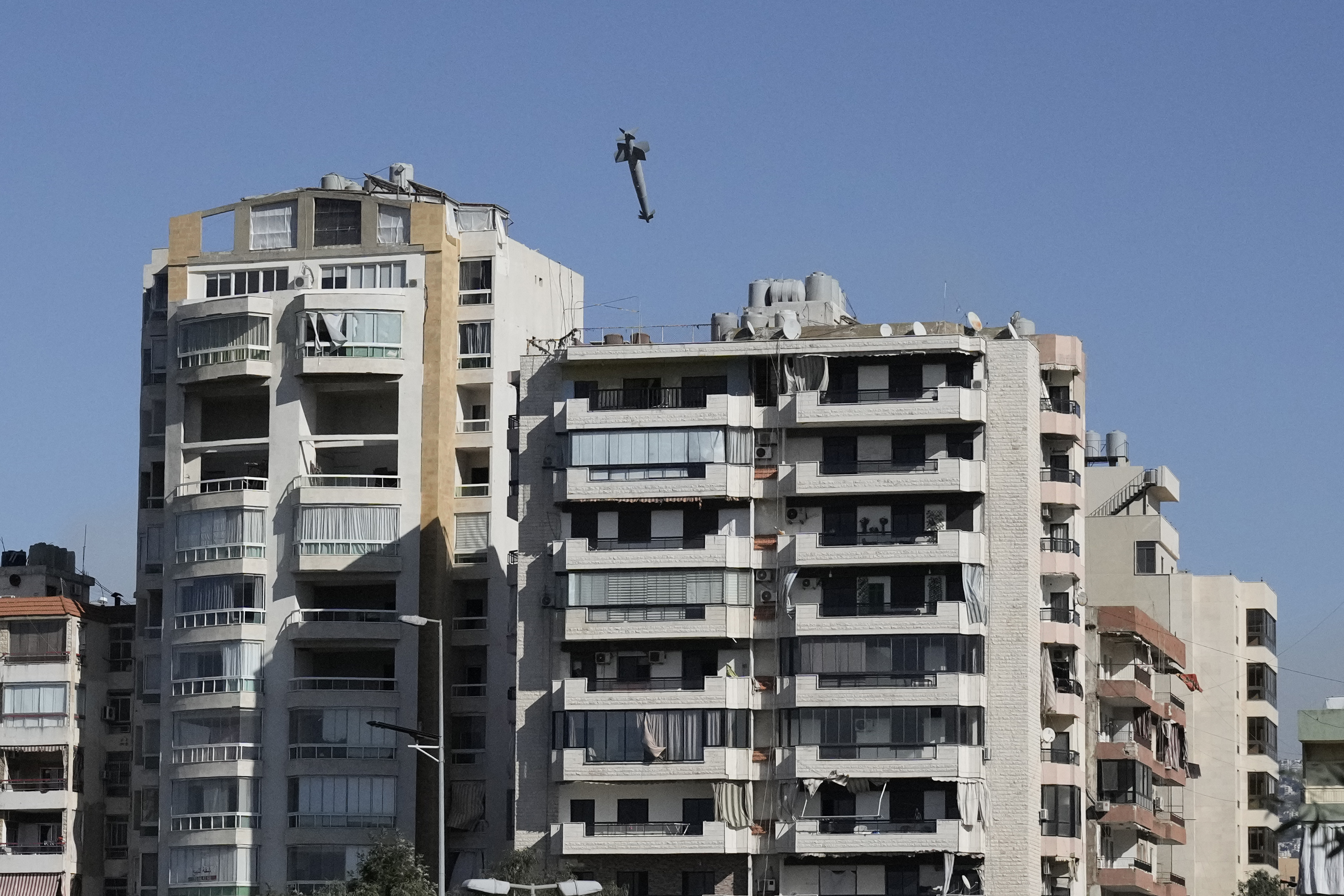 Images capture exact moments an Israeli missile strikes building in Beirut