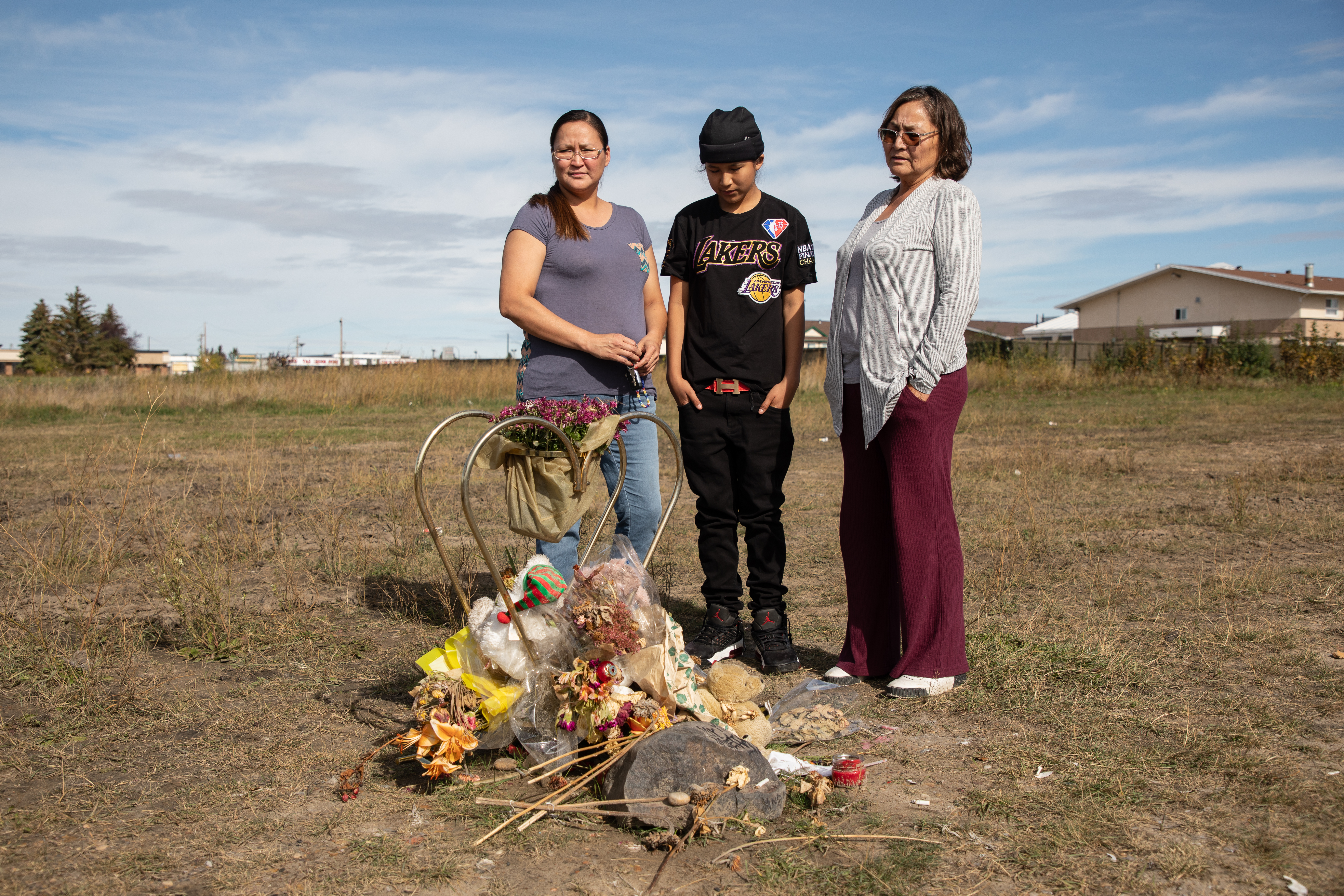 Nadalie Lightning, Kokum (grandmother) to Hoss Lightning, 15, visits his memorial with his aunty Trisha Saddleback and cousin, Trevor Wolf,