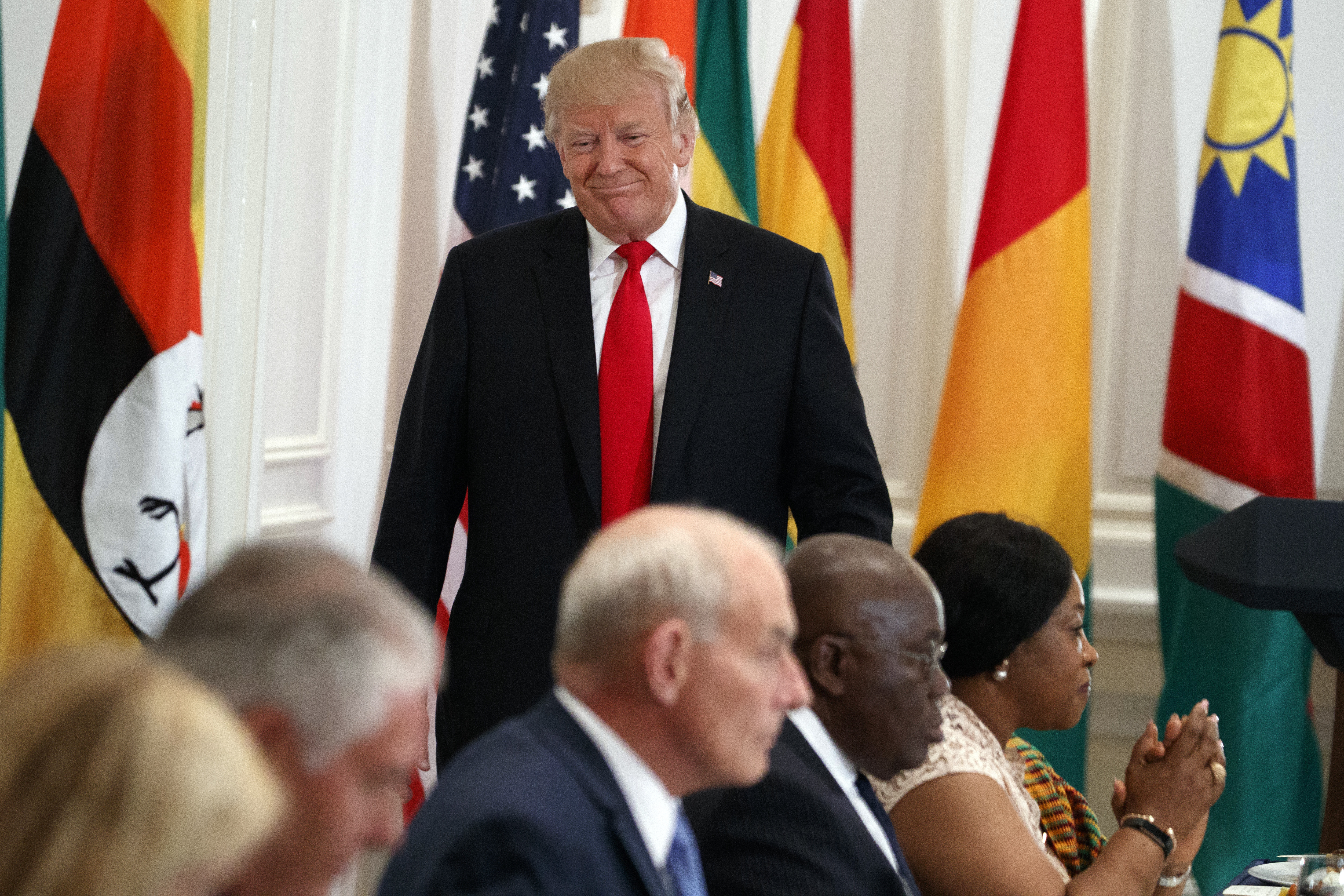 President Donald Trump walks to his seat after speaking during a luncheon with African leaders at the Palace Hotel during the United Nations General Assembly, Wednesday, Sept. 20, 2017, in New York. (AP Photo/Evan Vucci)