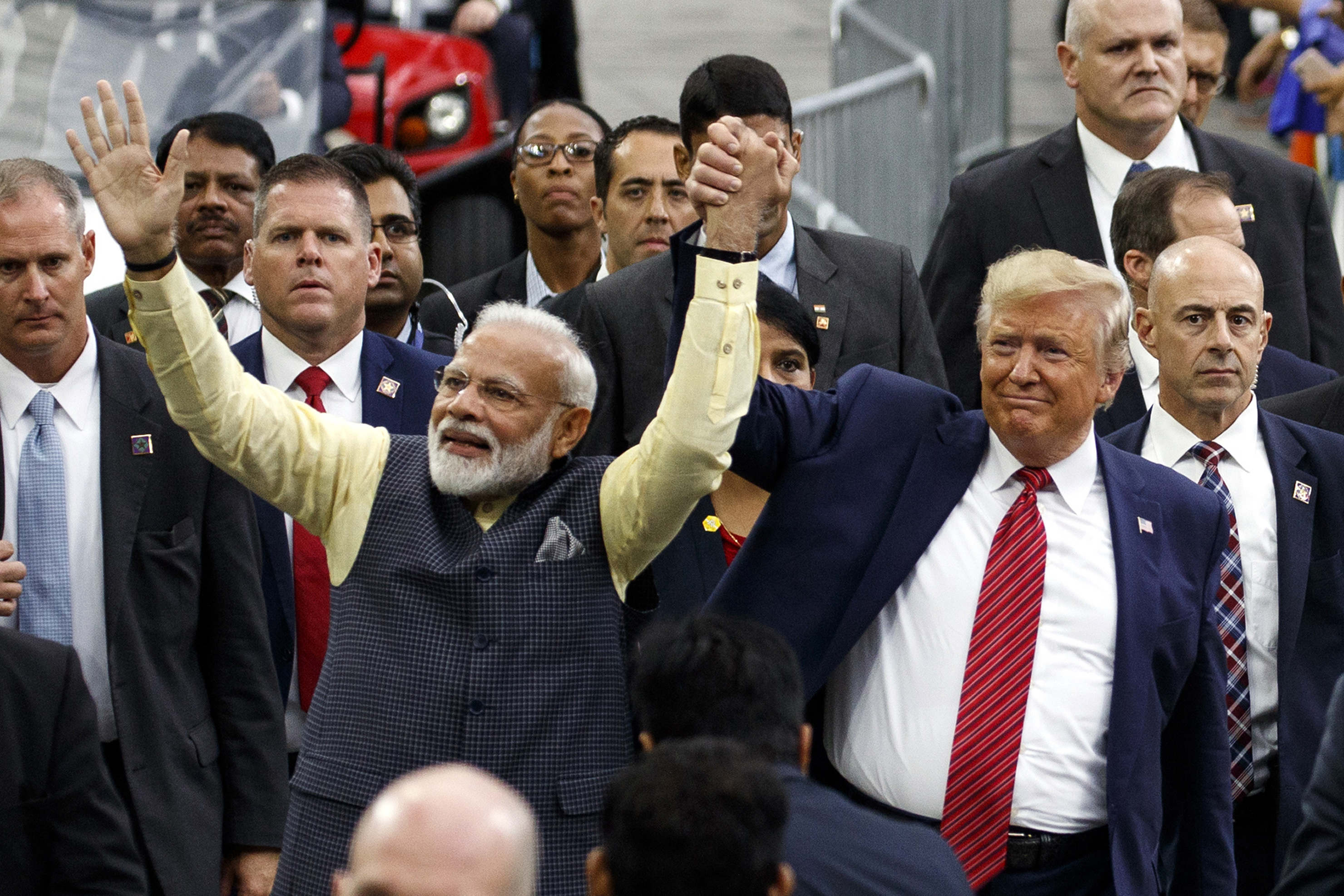 President Donald Trump and Indian Prime Minister Narendra Modi walk around NRG Stadium waving to the crowd during the "Howdy Modi: Shared Dreams, Bright Futures" event, Sunday, Sept. 22, 2019, in Houston. (AP Photo/Evan Vucci)