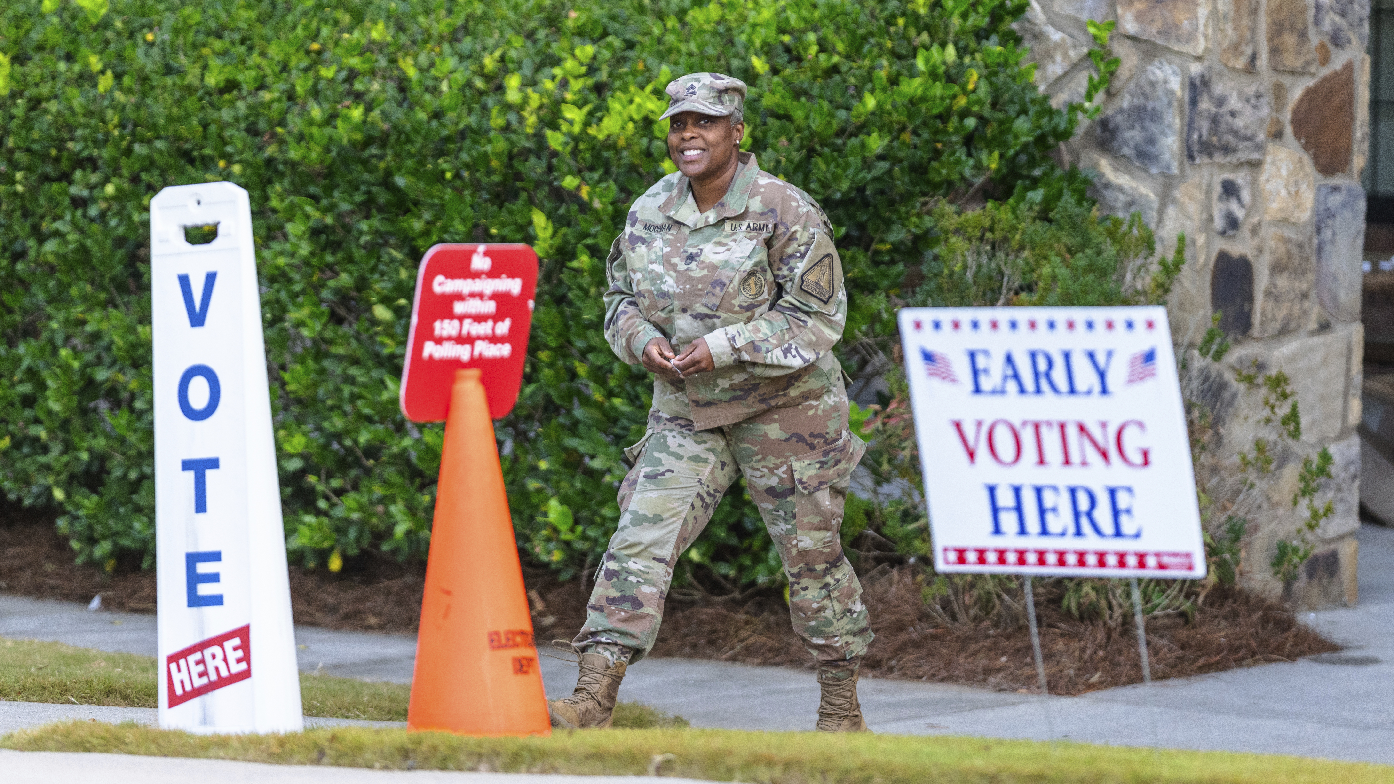 A U.S. soldier is seen exiting a polling station, Thursday, Oct. 31, 2024, in Stockbridge, Ga.