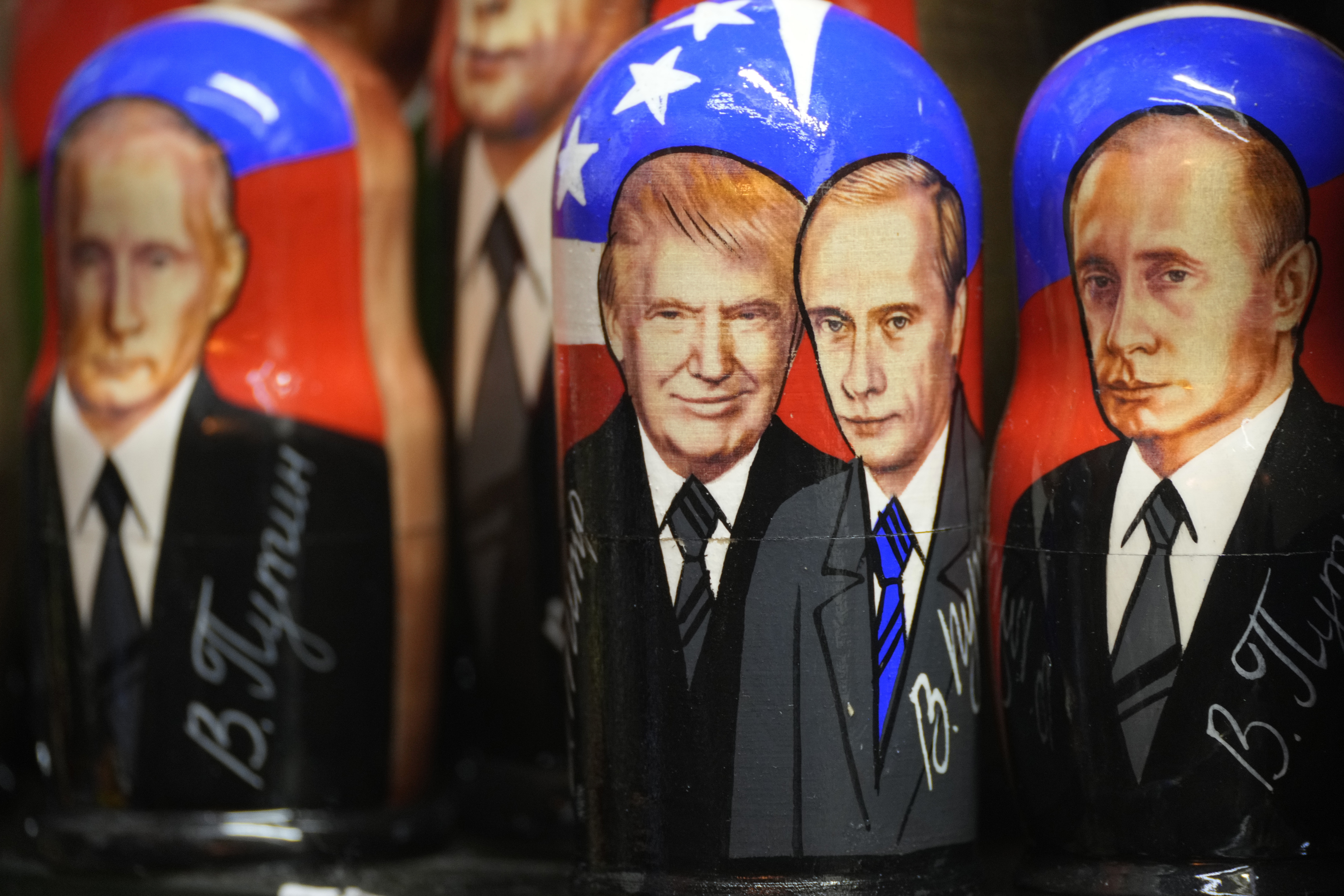 Traditional Russian wooden dolls, called Matryoshka, depicting Republican presidential nominee an former US President Donald Trump, center left, and Russian President Vladimir Putin are displayed for sale at a souvenir shop in St. Petersburg, Russia, Tuesday, Nov. 5, 2024. (AP Photo/Dmitri Lovetsky)