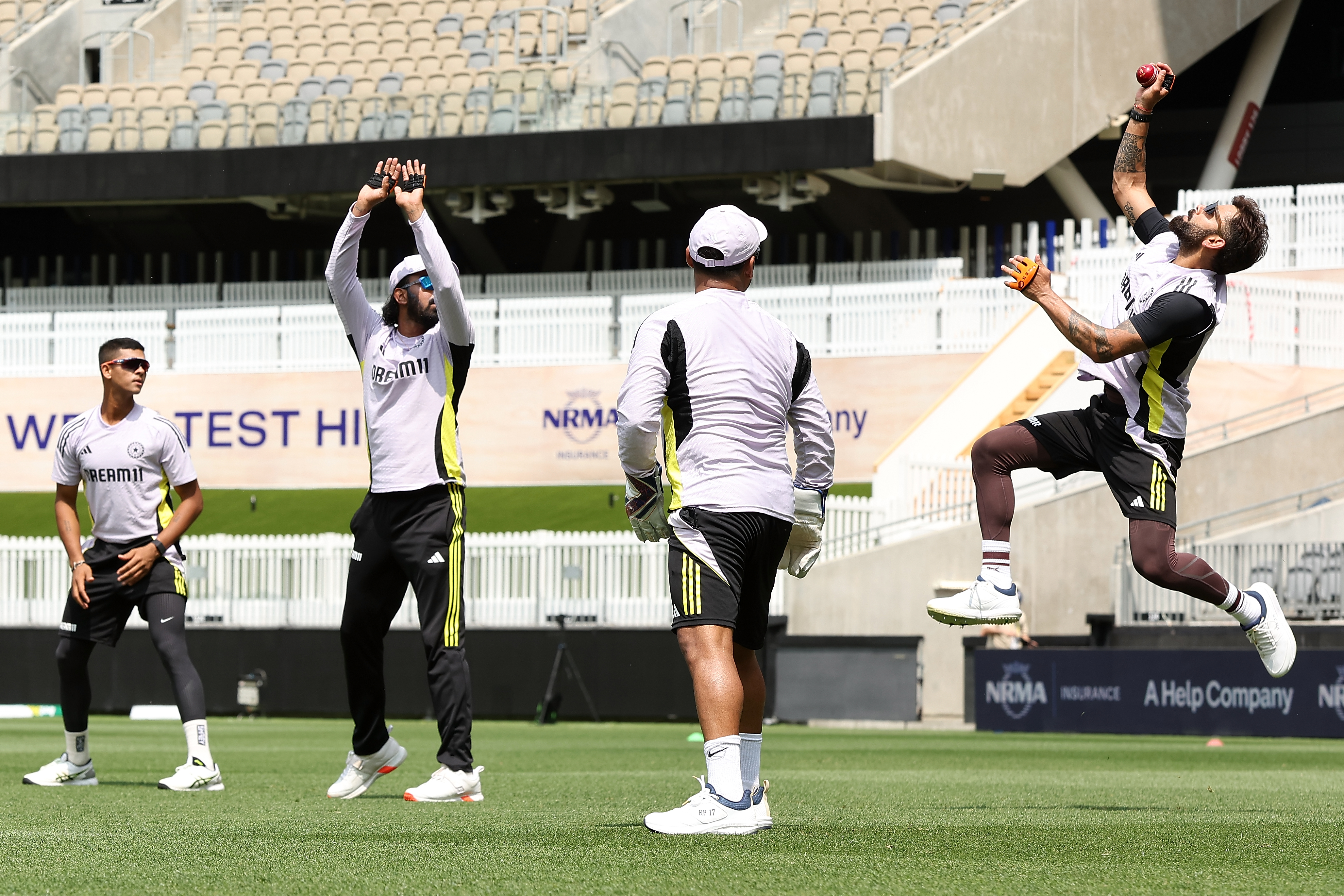 PERTH, AUSTRALIA - NOVEMBER 19: Virat Kohli of India takes a catch while working on slips drills during an India Test Squad training session at Optus Stadium on November 19, 2024 in Perth, Australia. (Photo by Paul Kane/Getty Images)