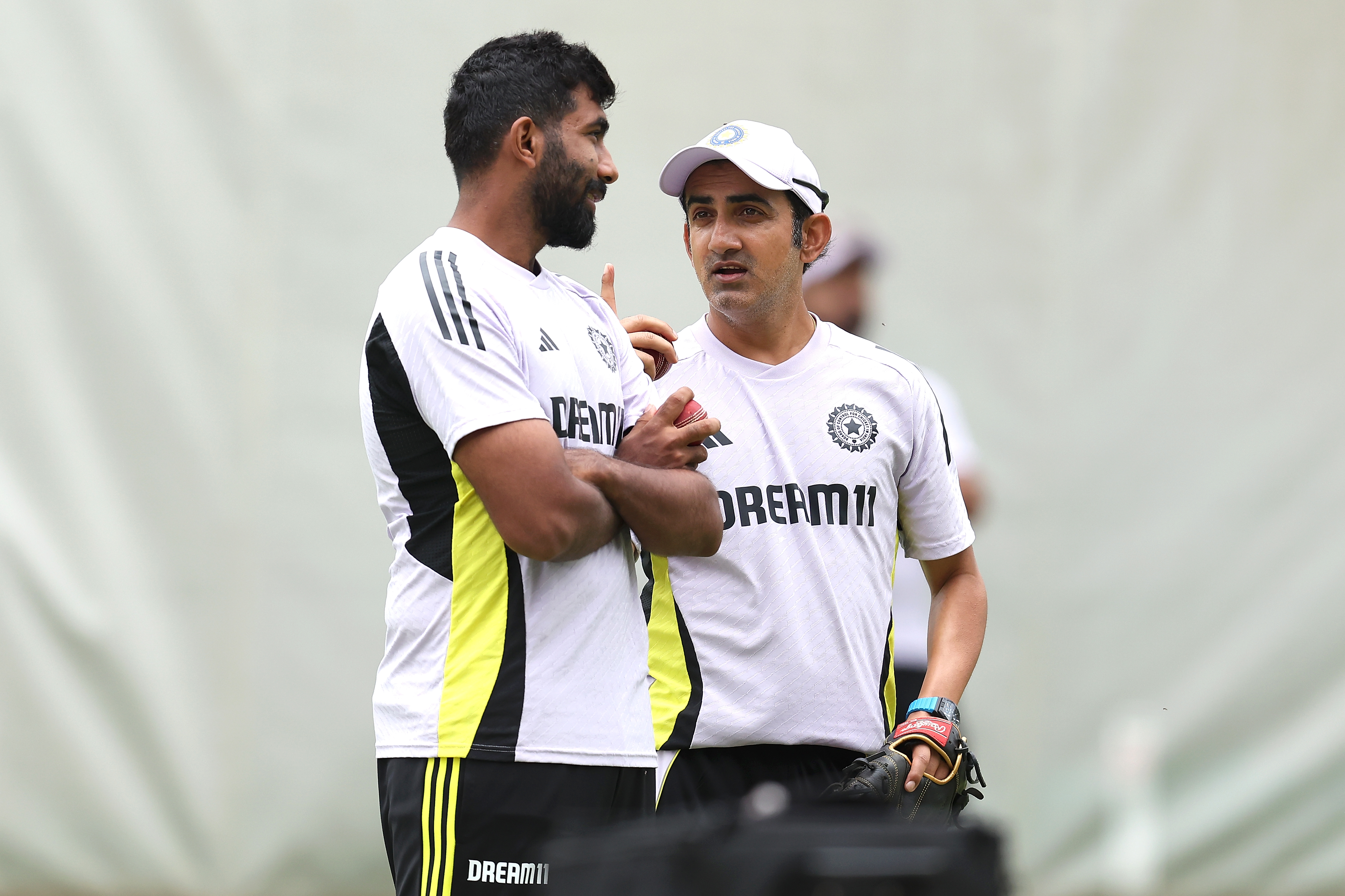 PERTH, AUSTRALIA - NOVEMBER 19: Jasprit Bumrah and Gautam Gambhir, head coach of India talk during an India Test Squad training session at Optus Stadium on November 19, 2024 in Perth, Australia. (Photo by Paul Kane/Getty Images)
