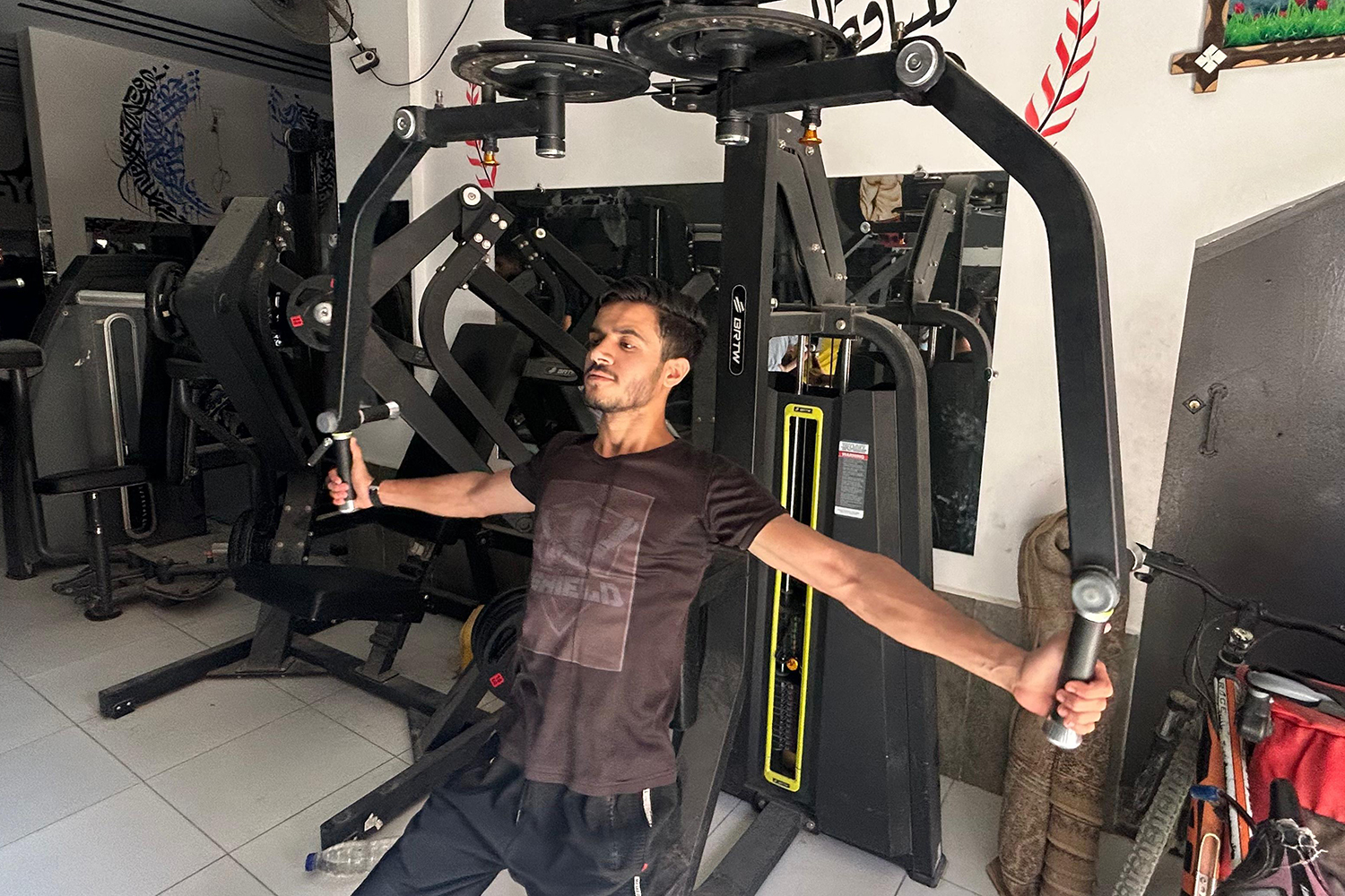 Mohamed Hatem performing gym exercise.