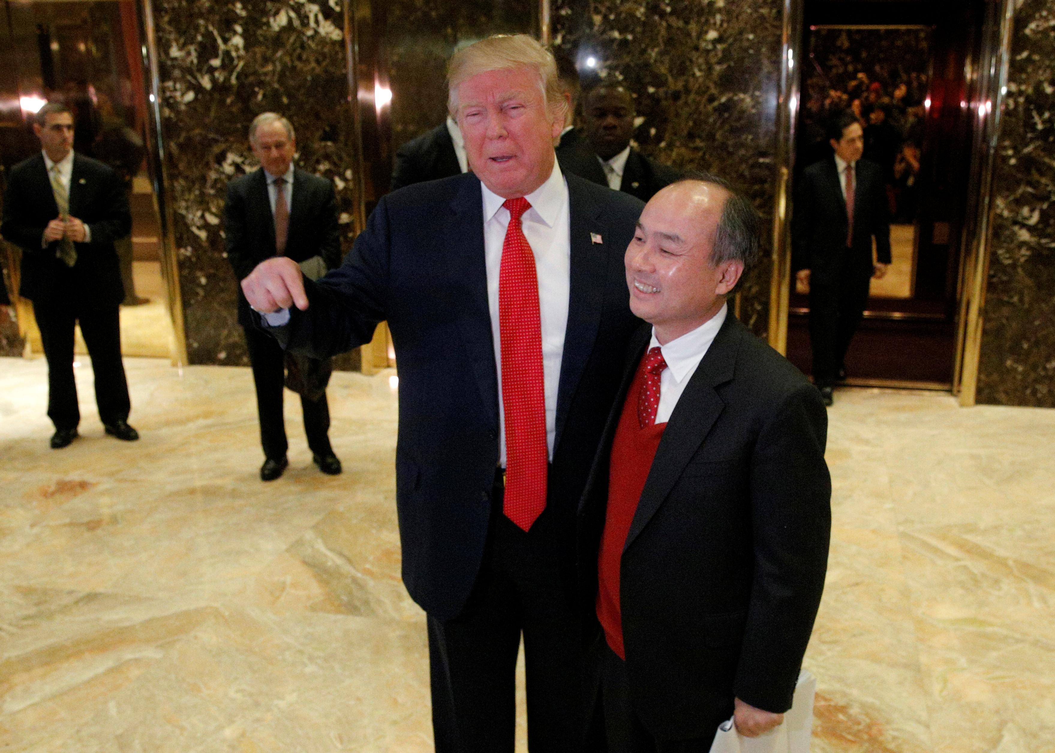 U.S. President-elect Donald Trump and Softbank CEO Masayoshi Son speak to the press after meeting at Trump Tower in Manhattan, New York City, U.S., December 6, 2016.
