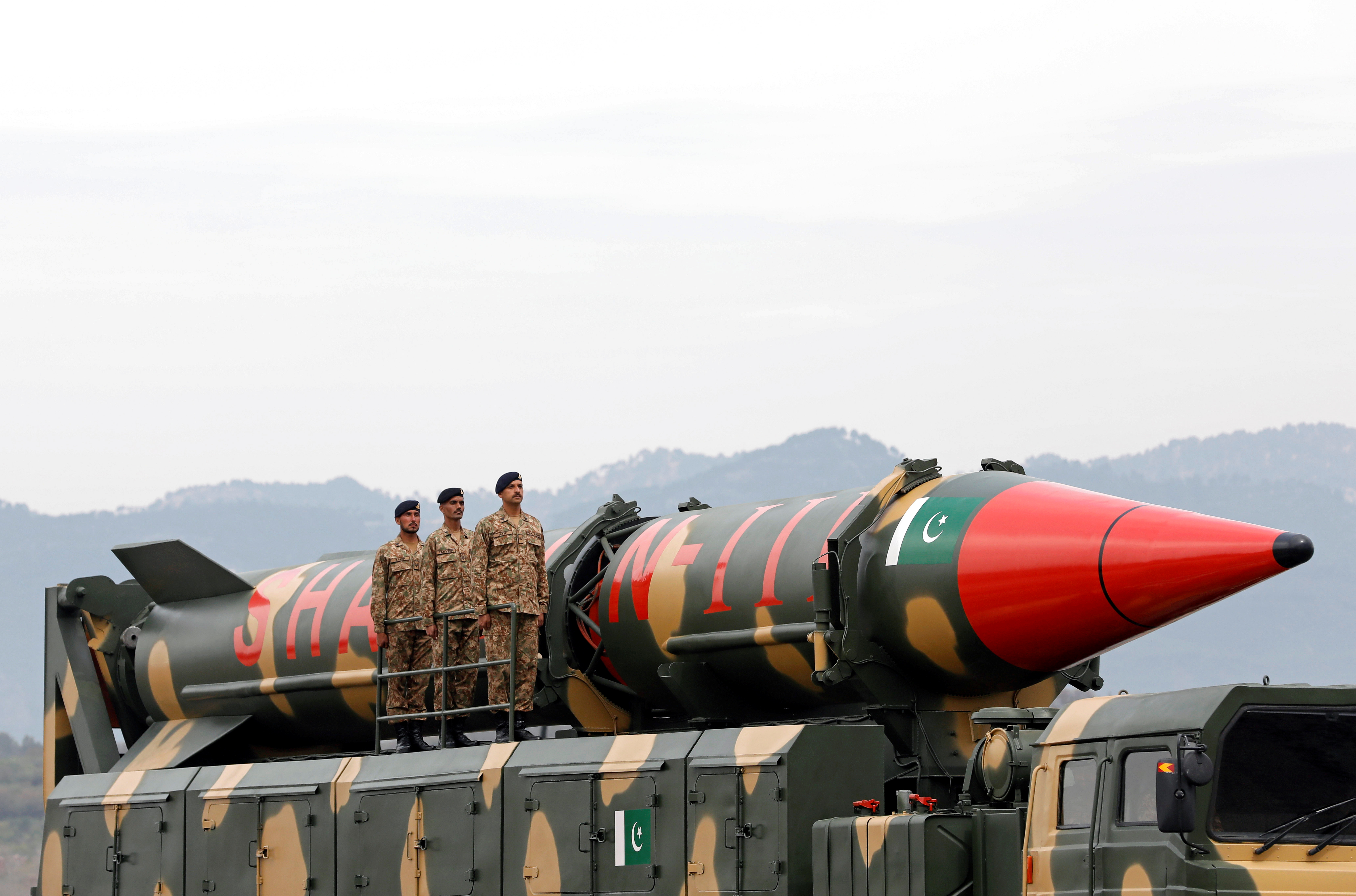 Pakistani military personnel stand beside a Shaheen III surface-to-surface ballistic missile during Pakistan Day military parade in Islamabad, Pakistan March 23, 2019.