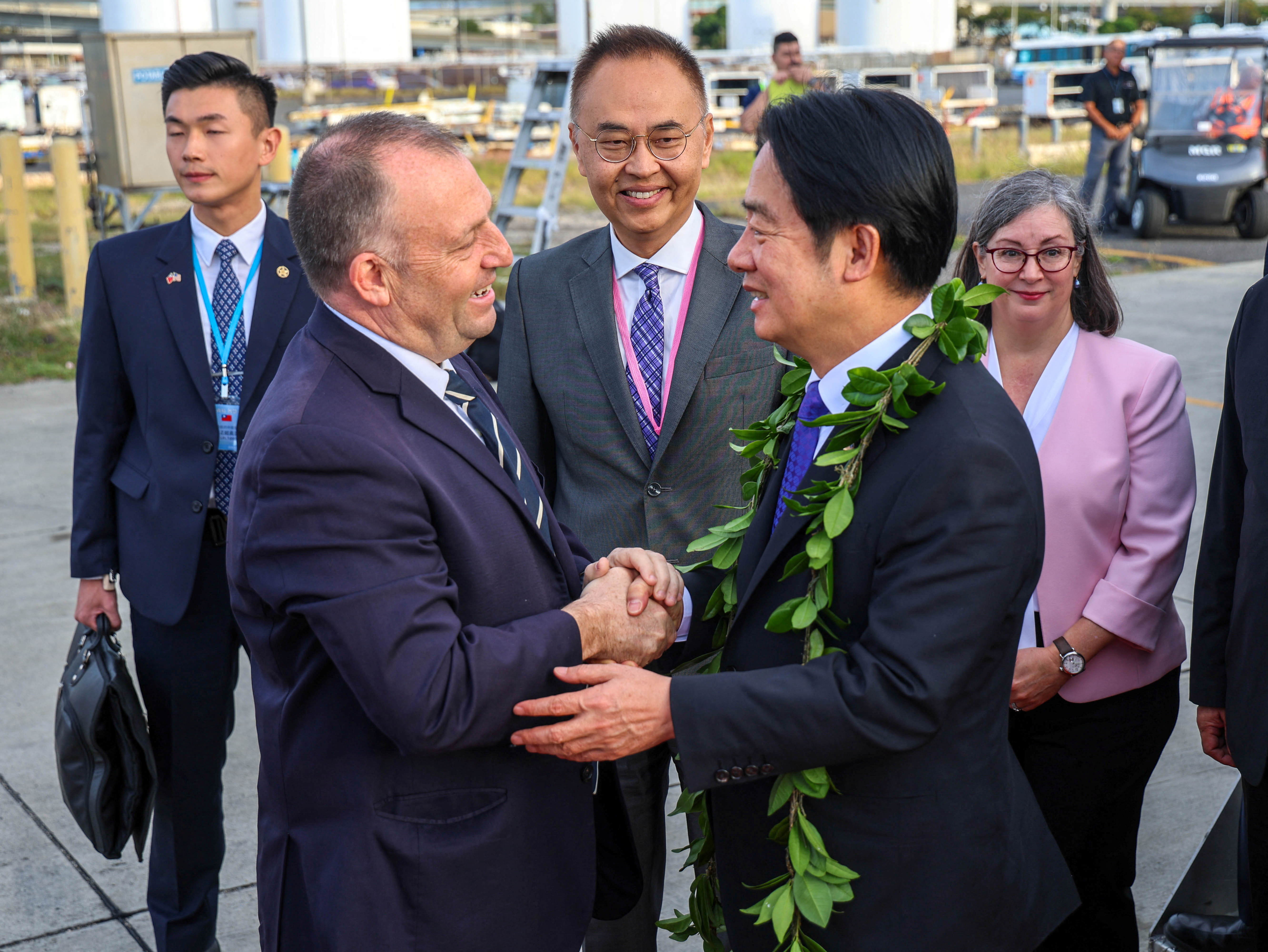 Taiwan's President Lai [right] is welcomed by Hawaii Governor Josh Green during his arrival at Daniel K. Inouye International Airport in Honolulu [Office of Hawaii Governor/Handout via Reuters]