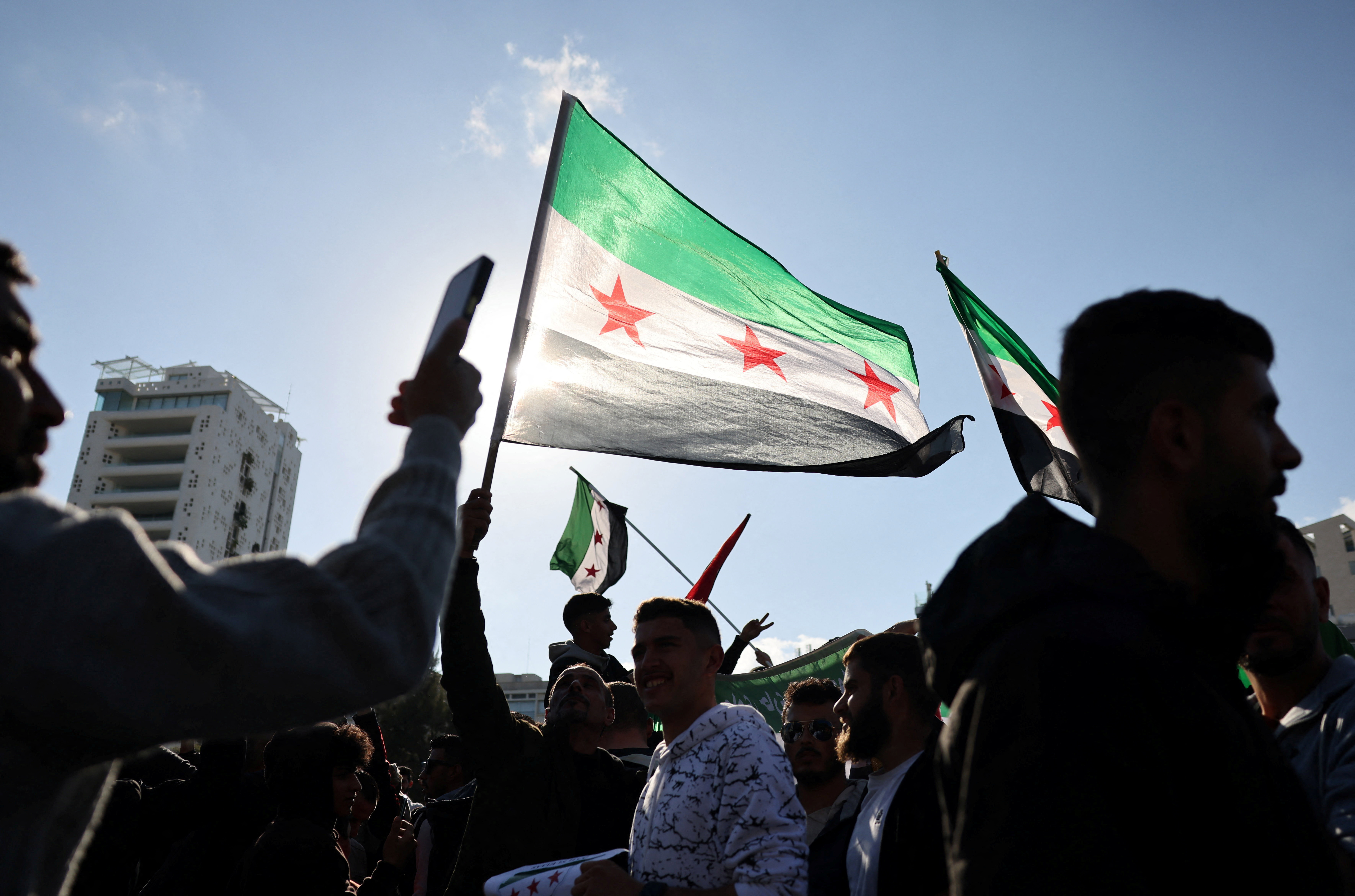 Syrian refugees around the world celebrate the fall of Bashar al-Assad