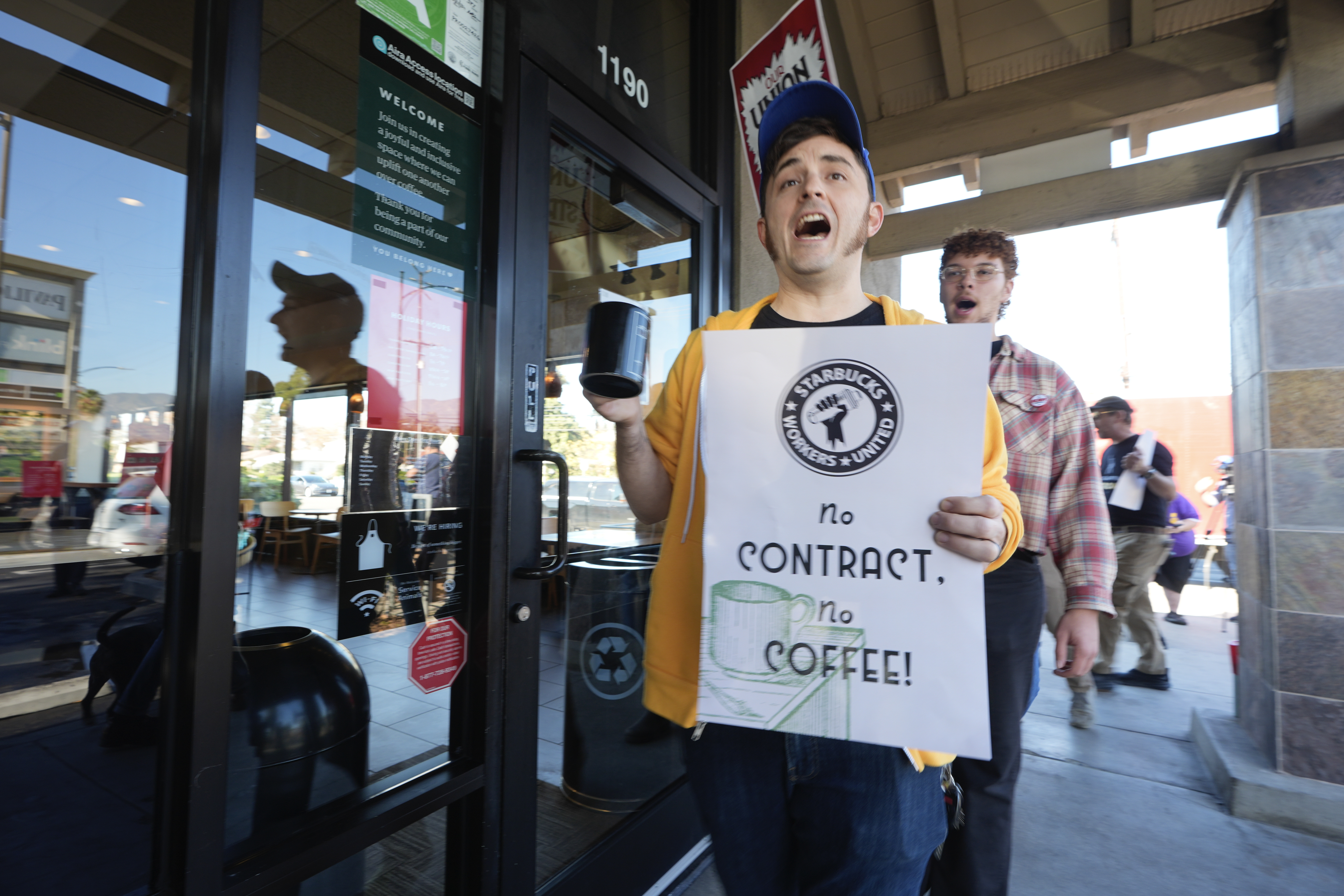 Starbuck workers picket outside of a closed Starbucks in Burbank, California