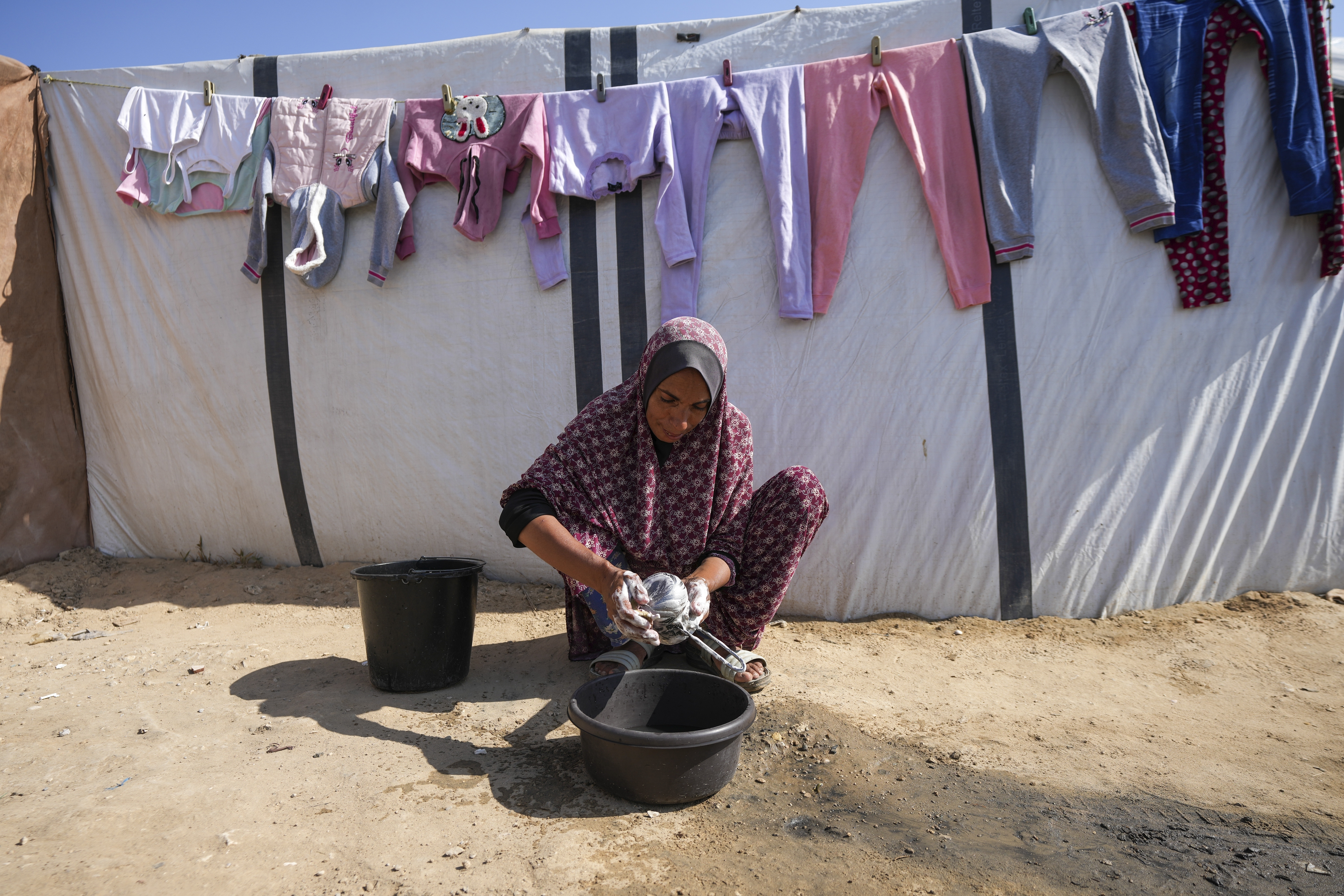 In Gaza's crowded tent camps, women wrestle with a life stripped of privacy