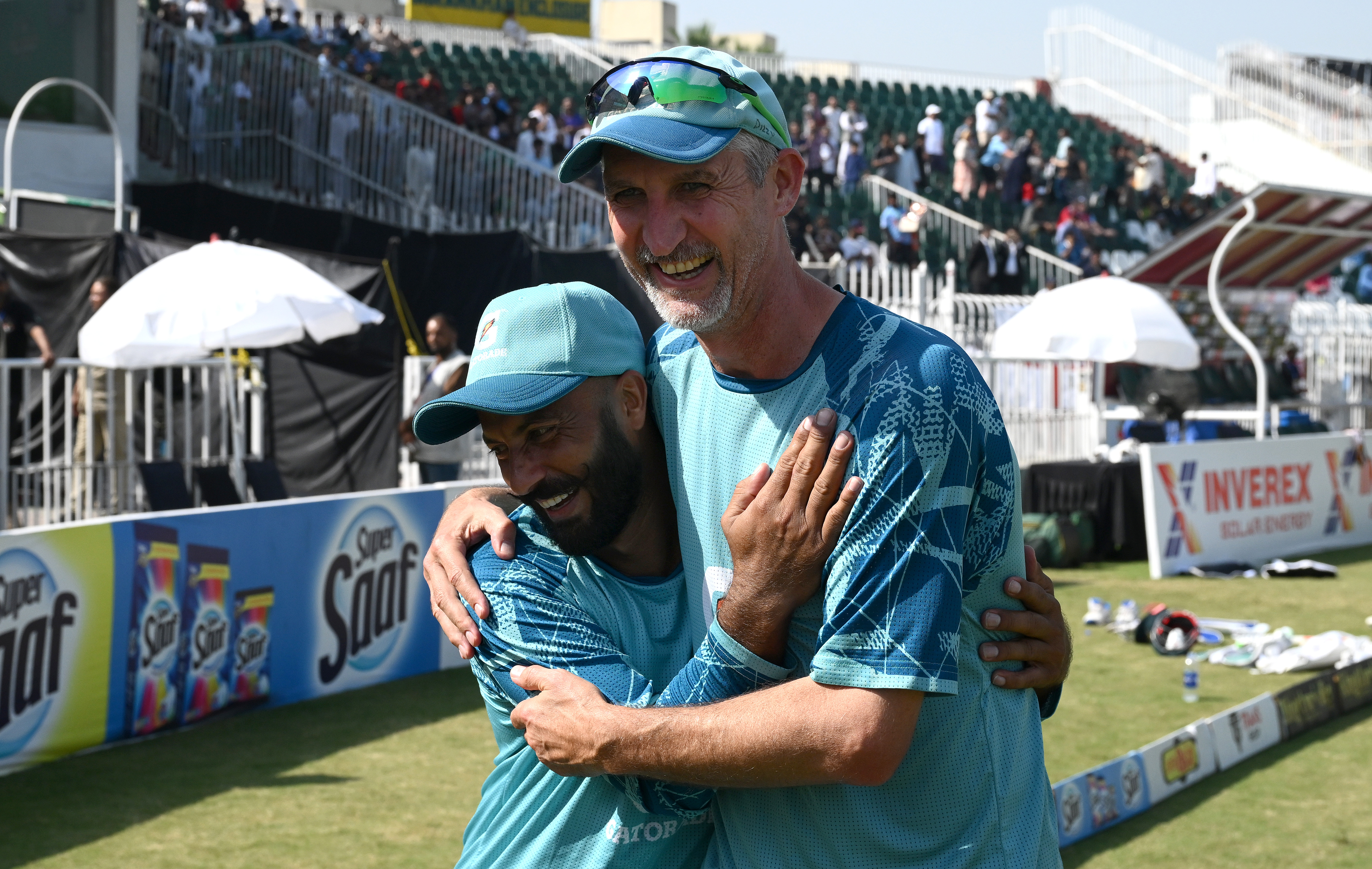 RAWALPINDI, PAKISTAN - OCTOBER 26: Pakistan bowler Sajid Khan is embraced by coach Jason Gillespie after Pakistan had won the match and the series 2-1 after day three of the 3rd Test Match between Pakistan and England at Rawalpindi Cricket Stadium on October 26, 2024 in Rawalpindi, Pakistan. (Photo by Stu Forster/Getty Images)