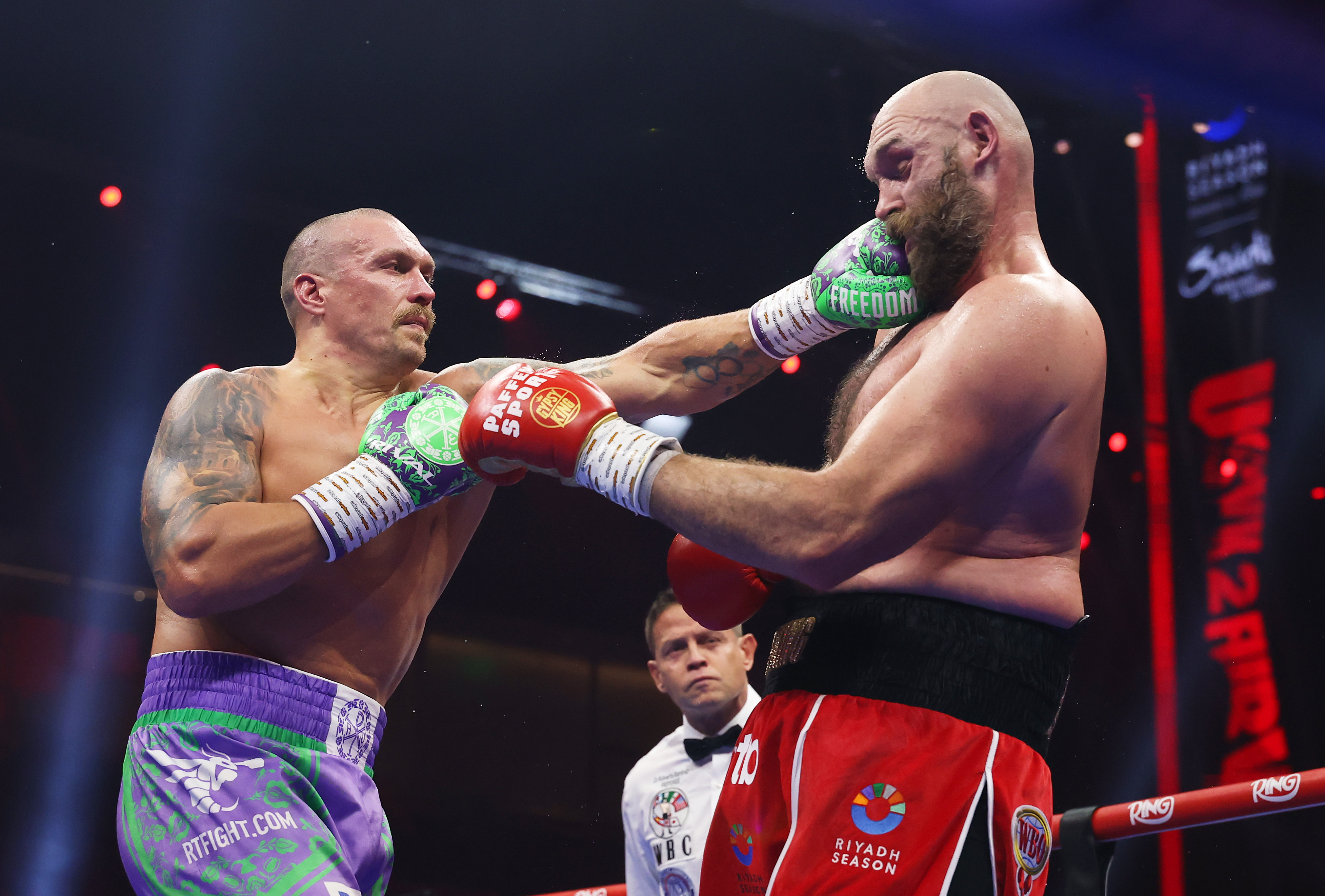 RIYADH, SAUDI ARABIA - DECEMBER 21: Oleksandr Usyk punches Tyson Fury during the IBF, IBO, WBA, WBC and WBO Undisputed World Heavyweight titles' fight between Oleksandr Usyk and Tyson Fury as part of Oleksandr Usyk v Tyson Fury 2, Reignited card at Kingdom Arena on December 21, 2024 in Riyadh, Saudi Arabia. (Photo by Richard Pelham/Getty Images)