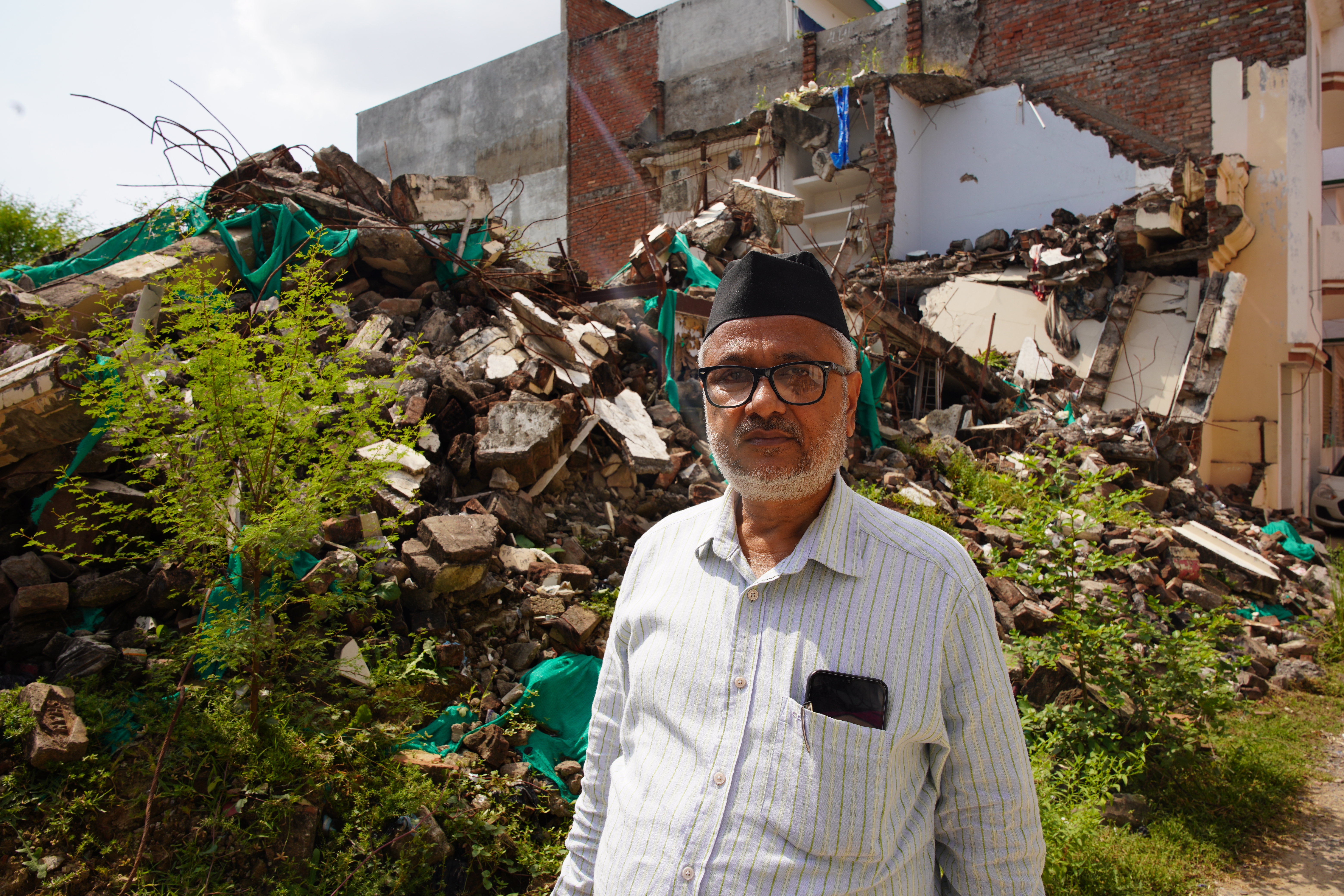 Muslim activist Javed Mohammed in India's Uttar Pradesh state outside his demolished house [Shivangi Mariam Raj/Al Jazeera]